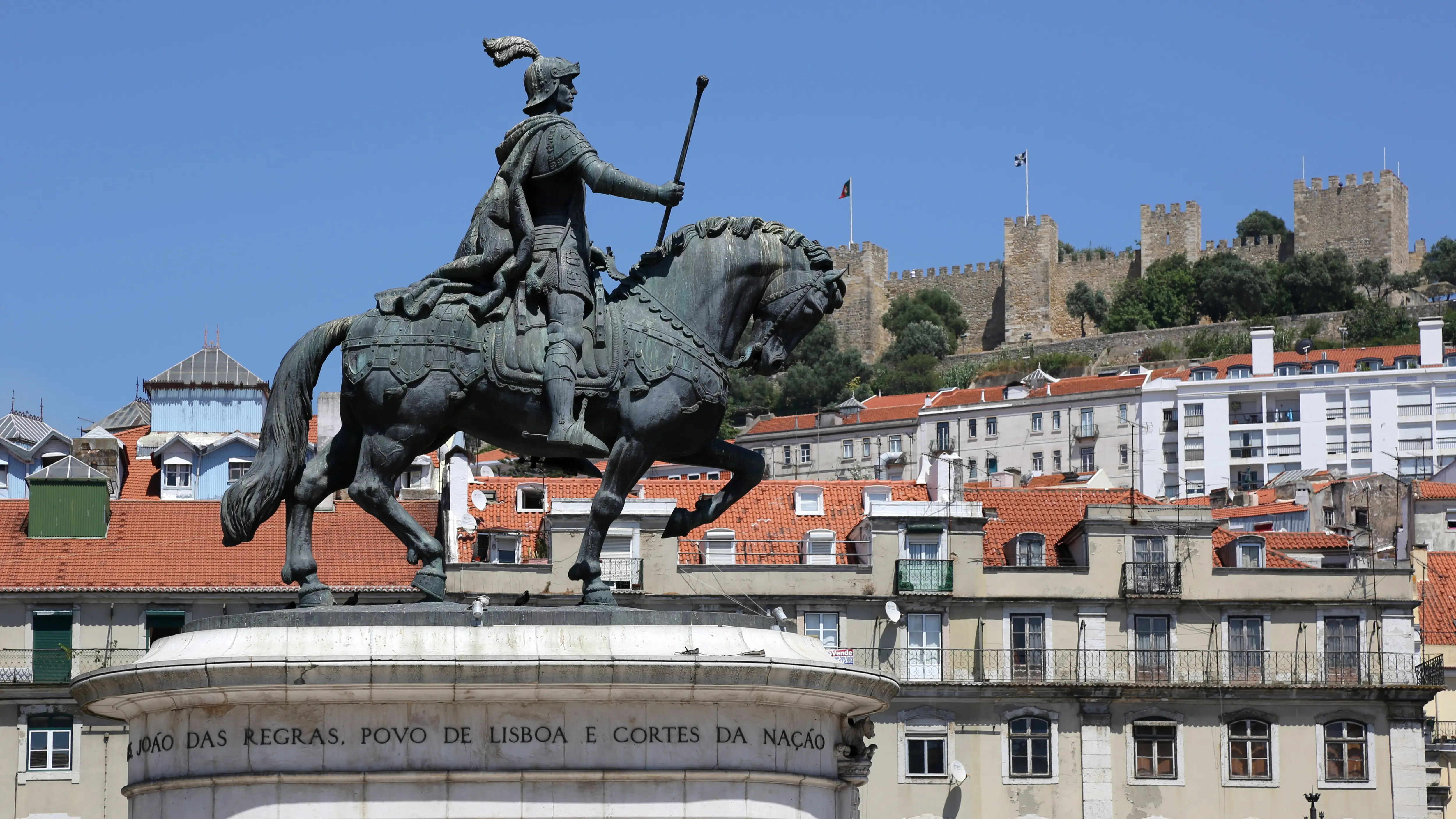 Equestrian statue of King João I with São Jorge Castle in the distance, Praça da Figueira, Lisbon, Portugal