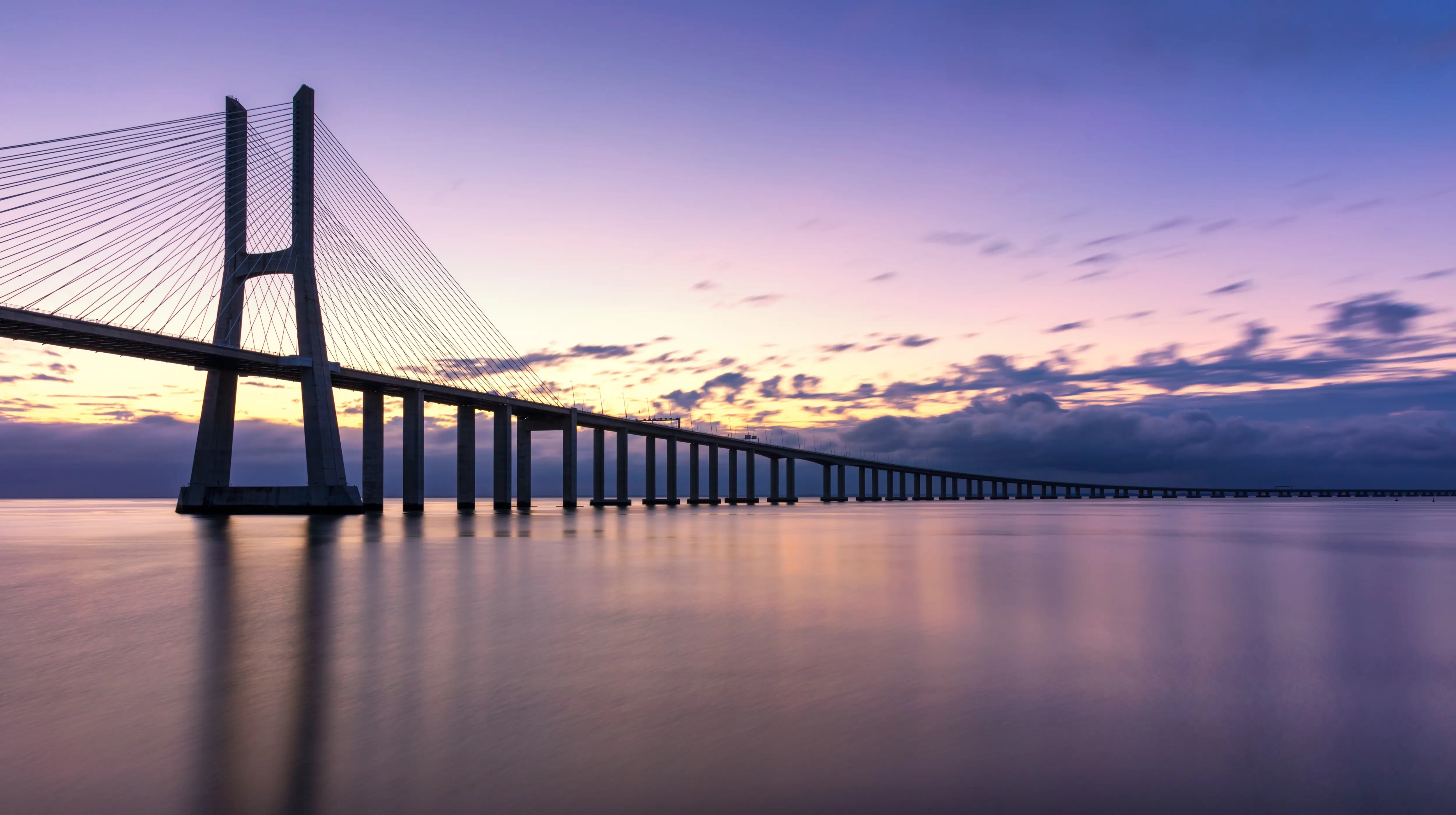 Vasco da Gama Bridge (Ponte Vasco da Gama) at sunset, Lisbon, Portugal