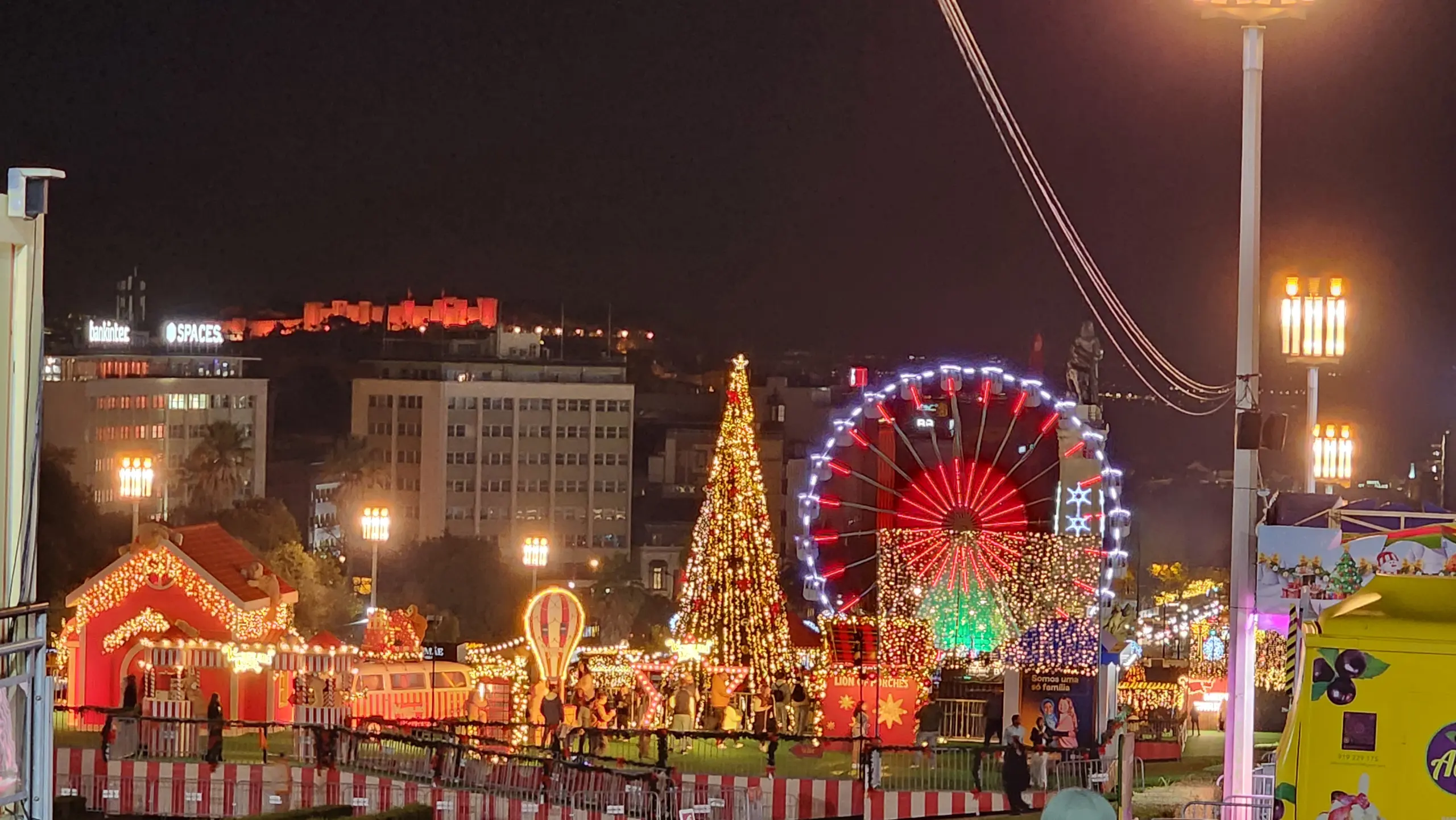 Giant Christmas tree and Ferris wheel, Wonderland Lisboa, Lisbon, Portugal