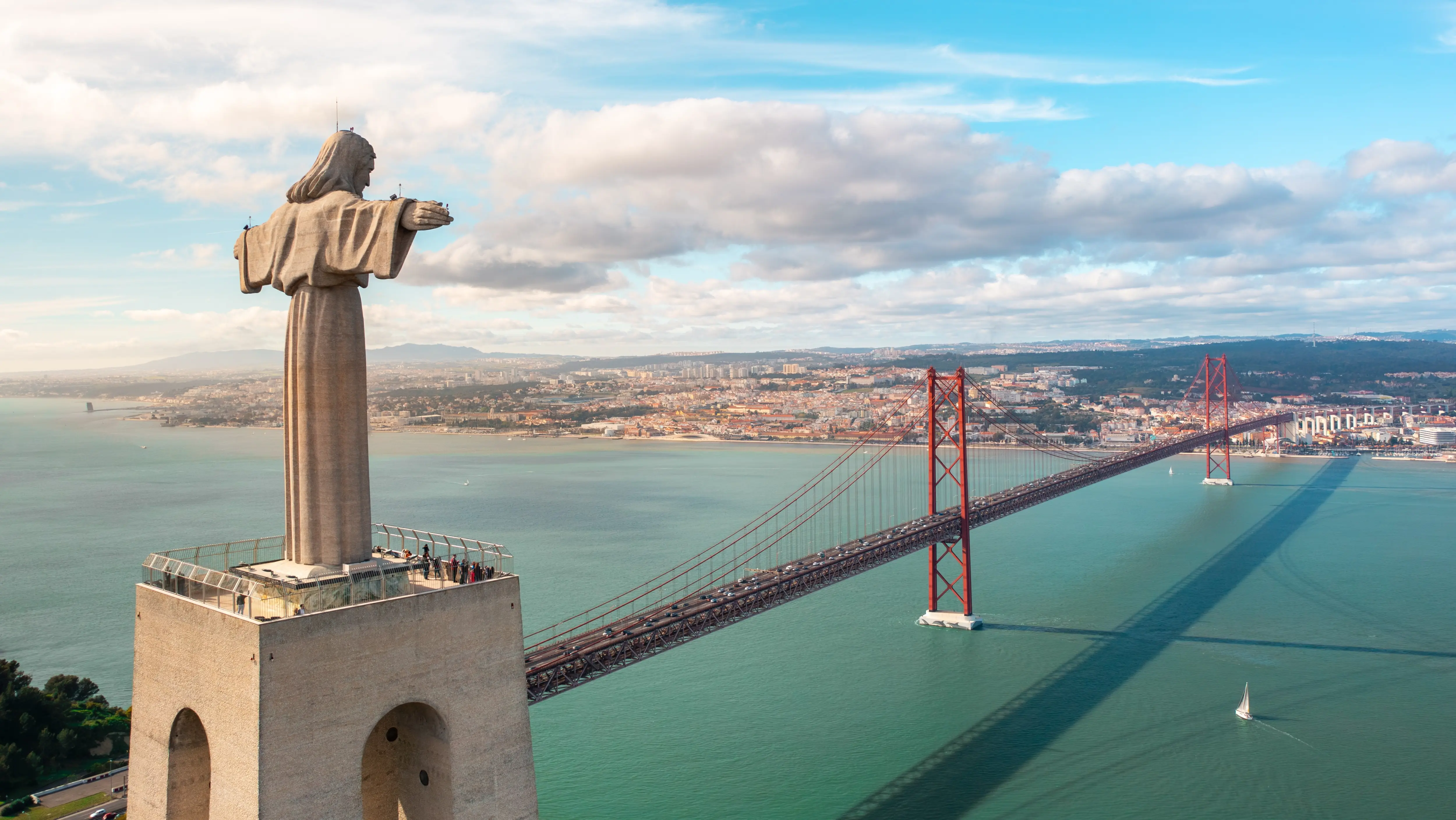 The 25 de Abril Bridge and the Sanctuary of Christ the King (Santuário de Cristo Rei), Lisbon, Portugal