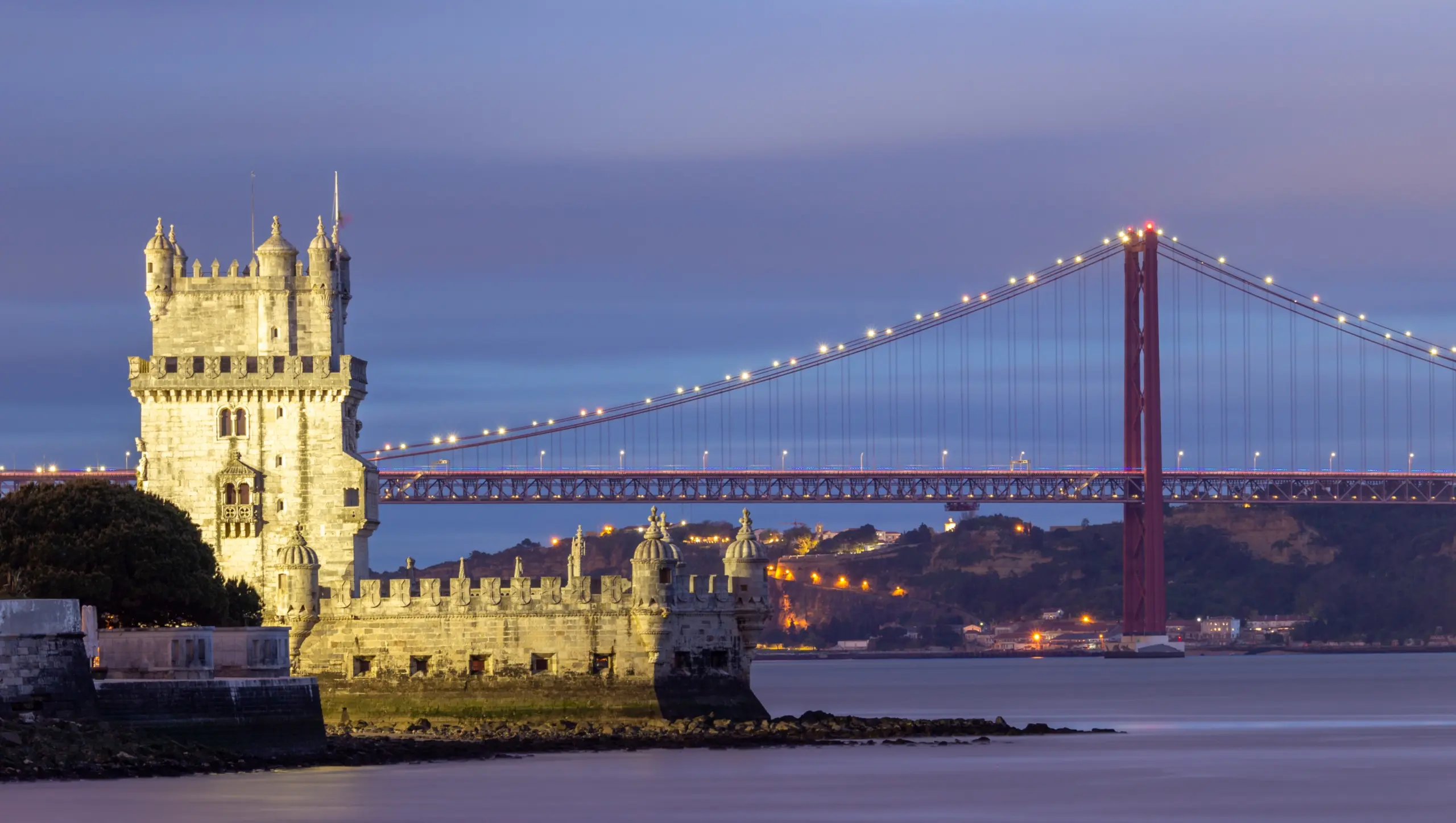 The Belém Tower and the 25 de Abril Bridge (Ponte 25 de Abril), Lisbon, Portugal