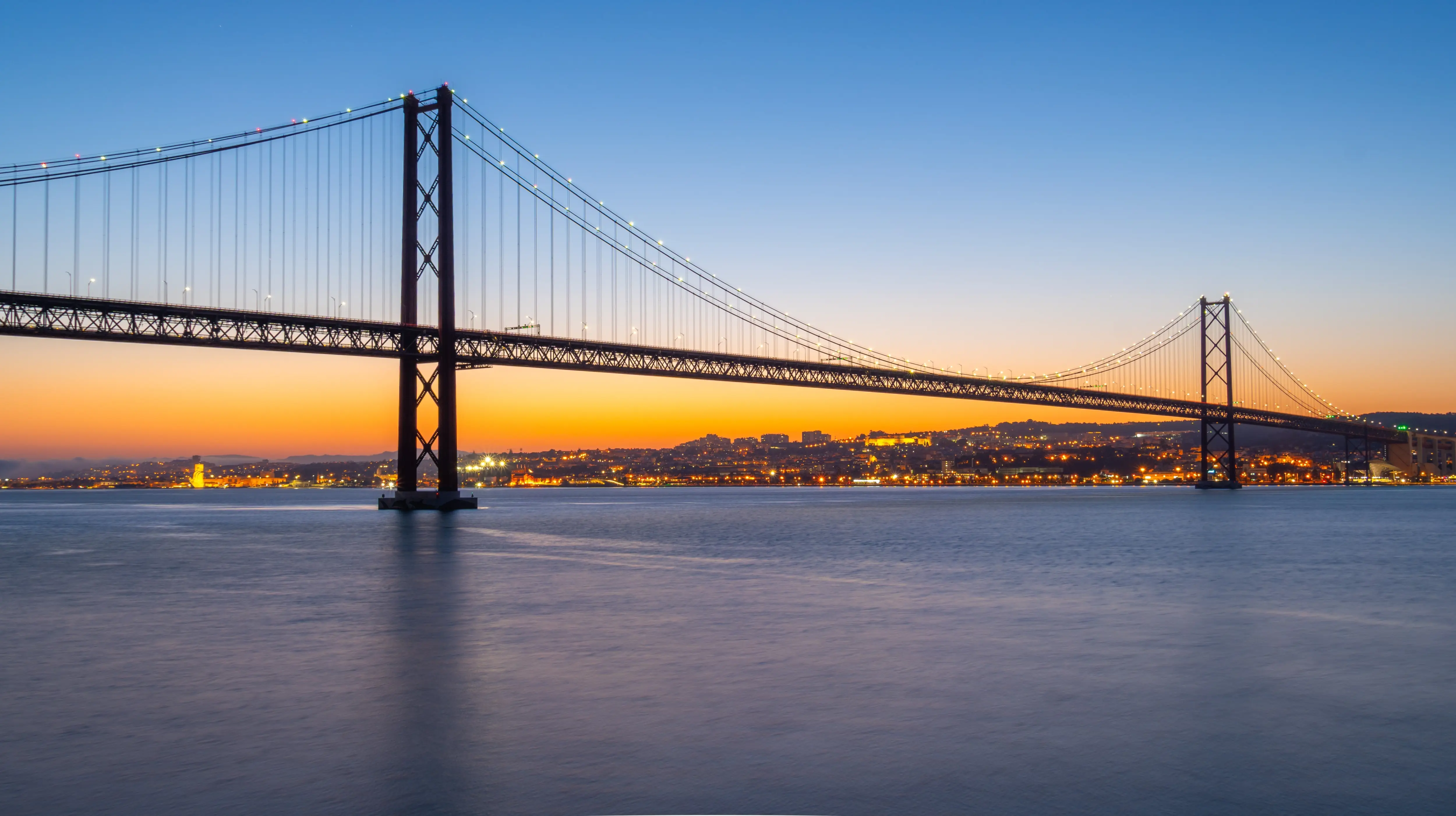 The 25 de Abril Bridge (Ponte 25 de Abril) at sunset, Lisbon, Portugal