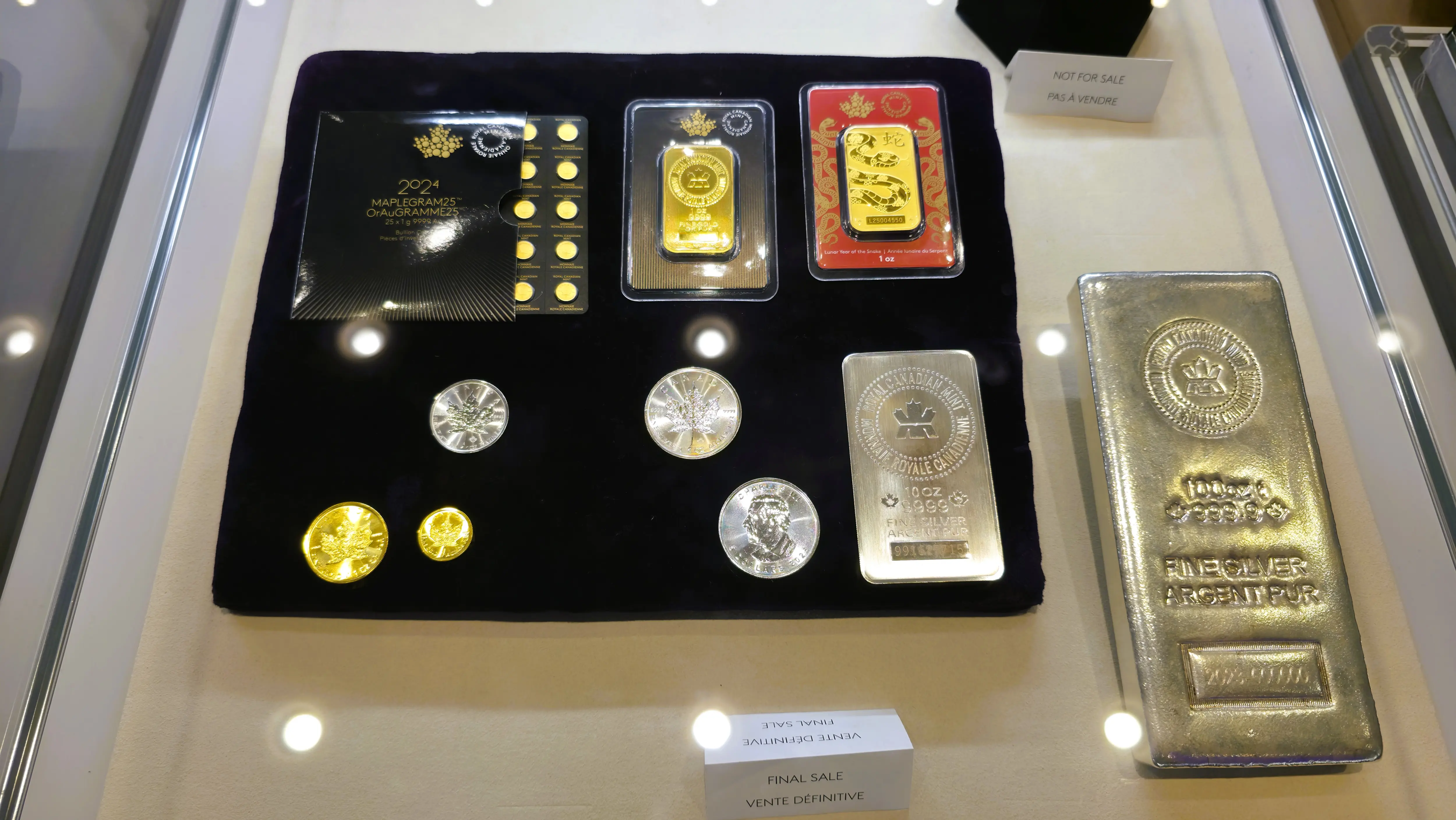 Collector coins and refined gold and silver bars on display at the Royal Canadian Mint in Ottawa, Canada