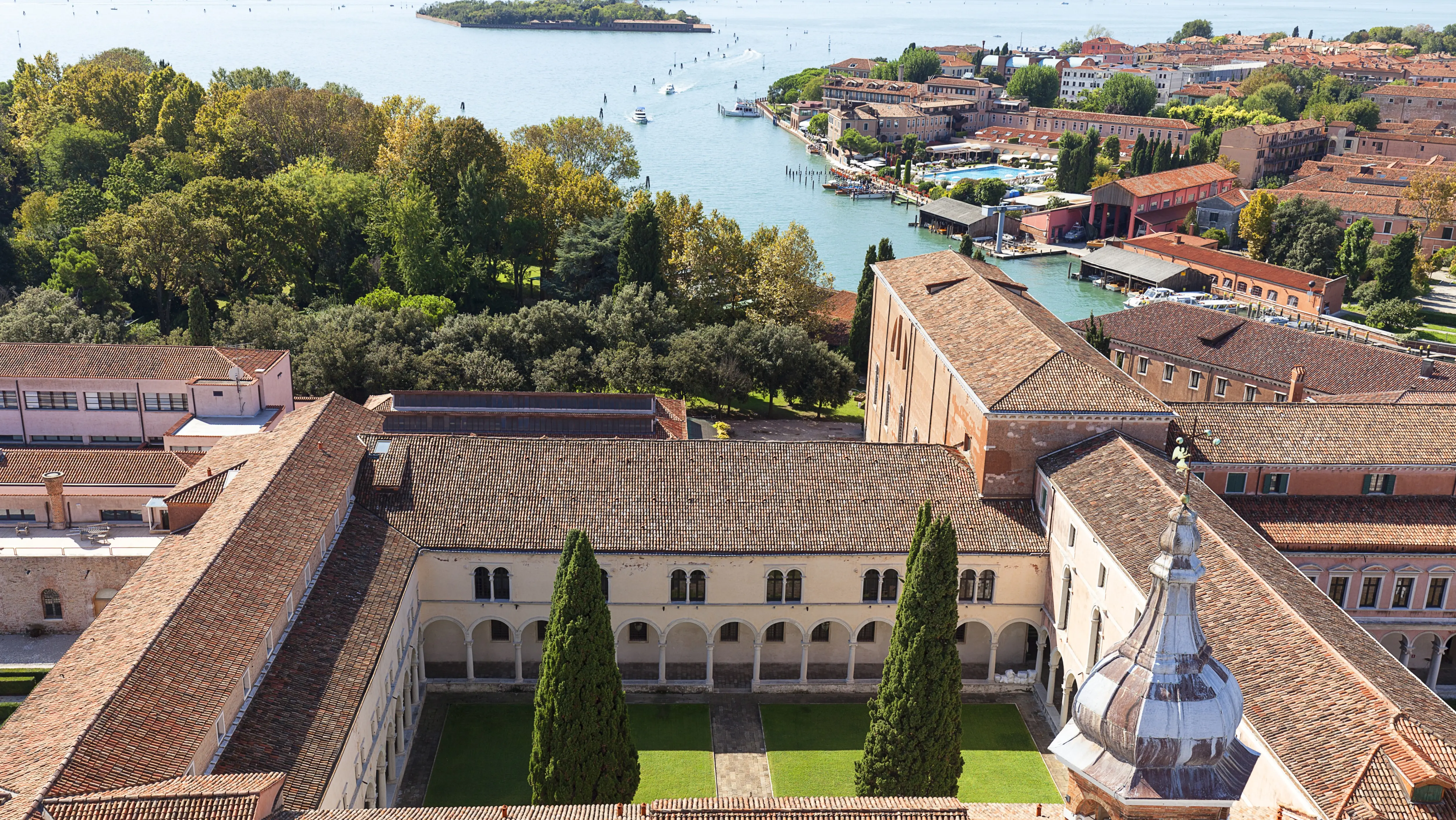 View Benedictine monastery San Giorgio Maggiore seen from bell tower Church San Giorgio Maggiore Venice Italy historic monastery complex founded 10th century unfolds below against calm waters Venetian Lagoon