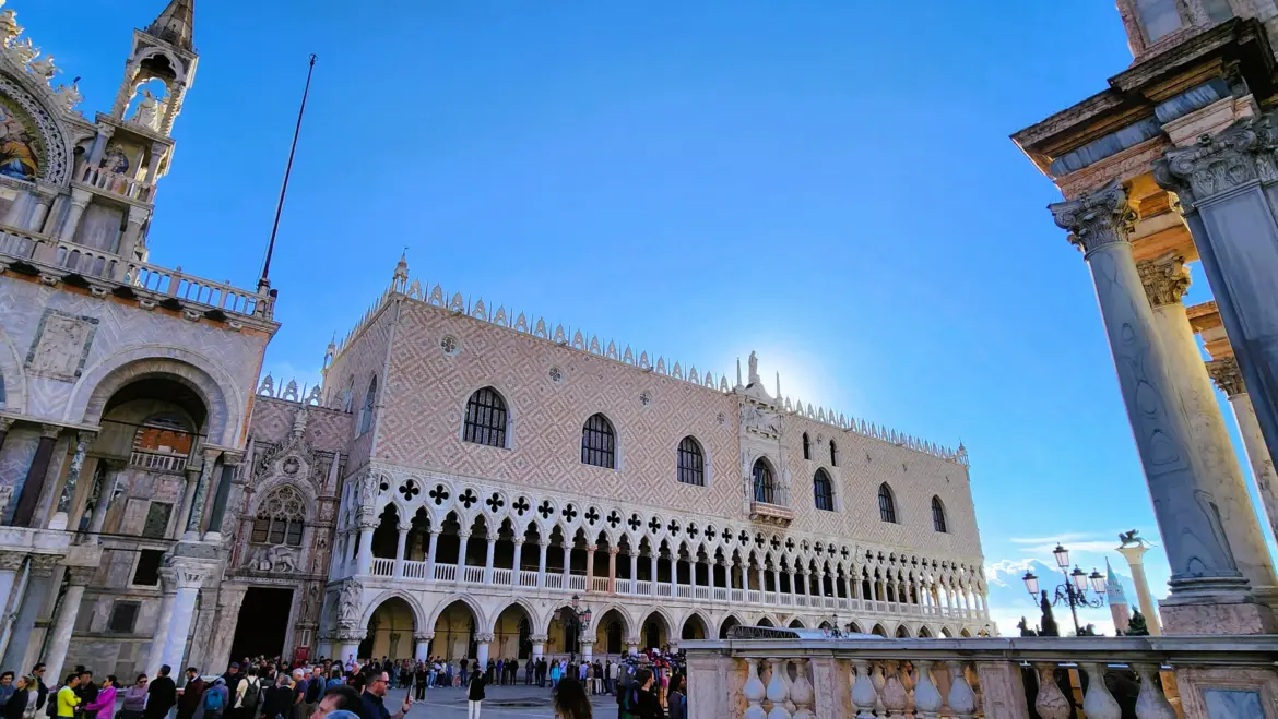 View Doge's Palace Piazzetta San Marco highlighting ornate Venetian Gothic architecture overlooking Venetian Lagoon Venice Italy