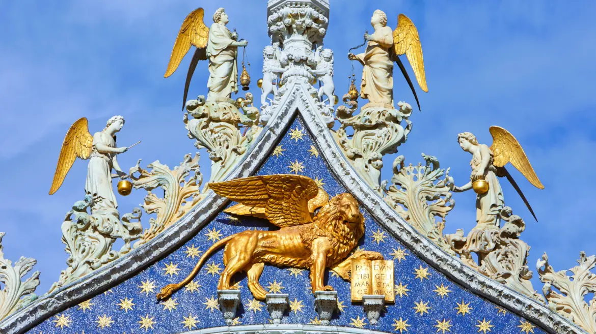Golden winged Lion of Saint Mark on façade St Mark's Basilica Venice Italy enduring symbol Venice patron saint