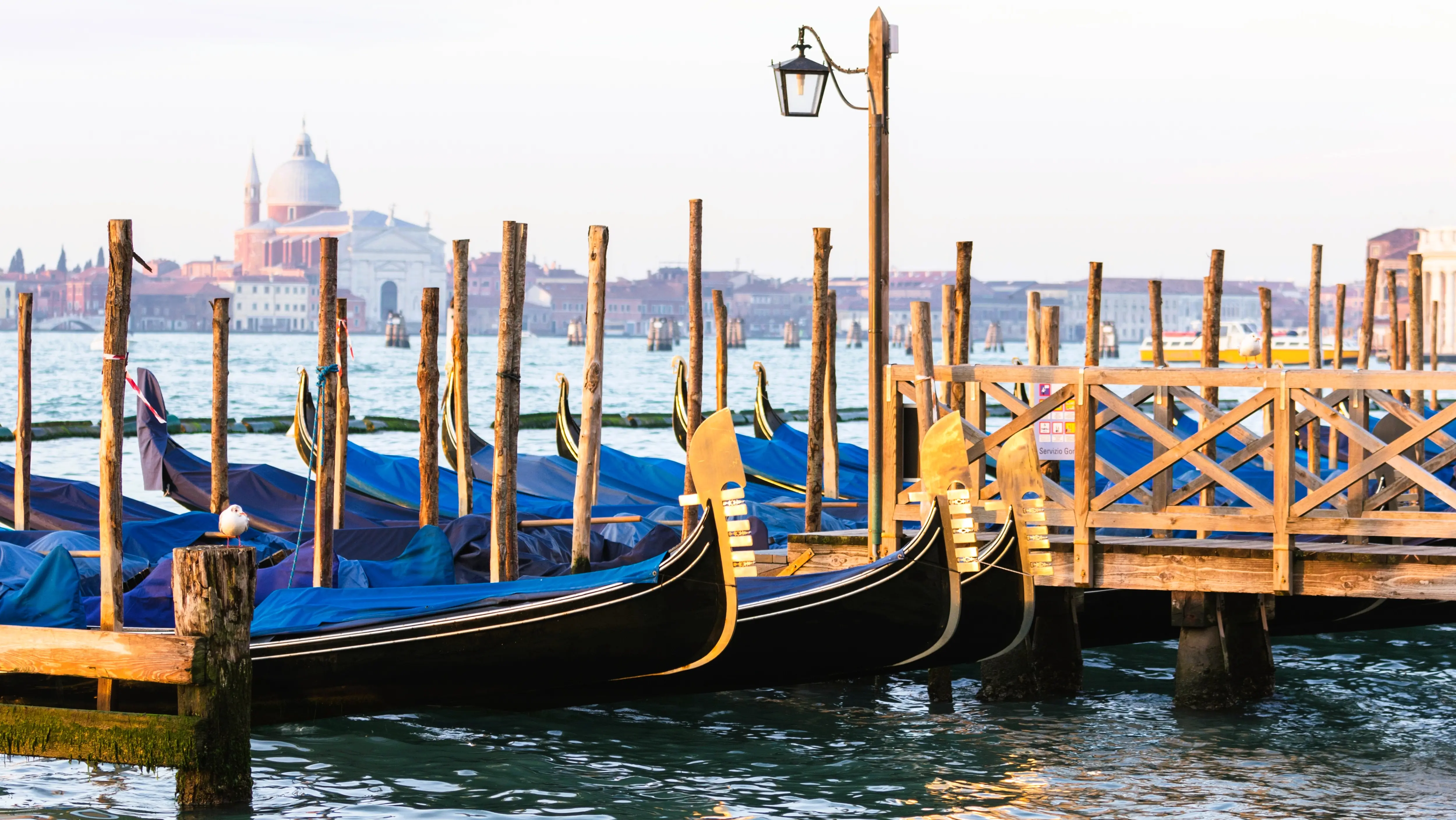 Gondola docking station Piazzetta San Marco where gondolas meet heart of Venice Italy
