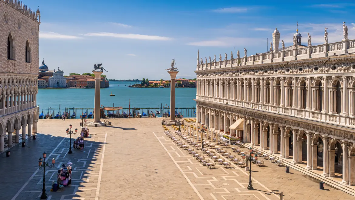Piazzetta San Marco Venice featuring iconic Columns St Mark and St Theodore standing at edge Venetian Lagoon