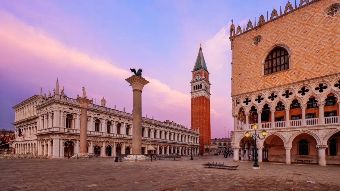 Piazzetta San Marco Venice featuring iconic Columns St Mark and St Theodore standing at edge Venetian Lagoon