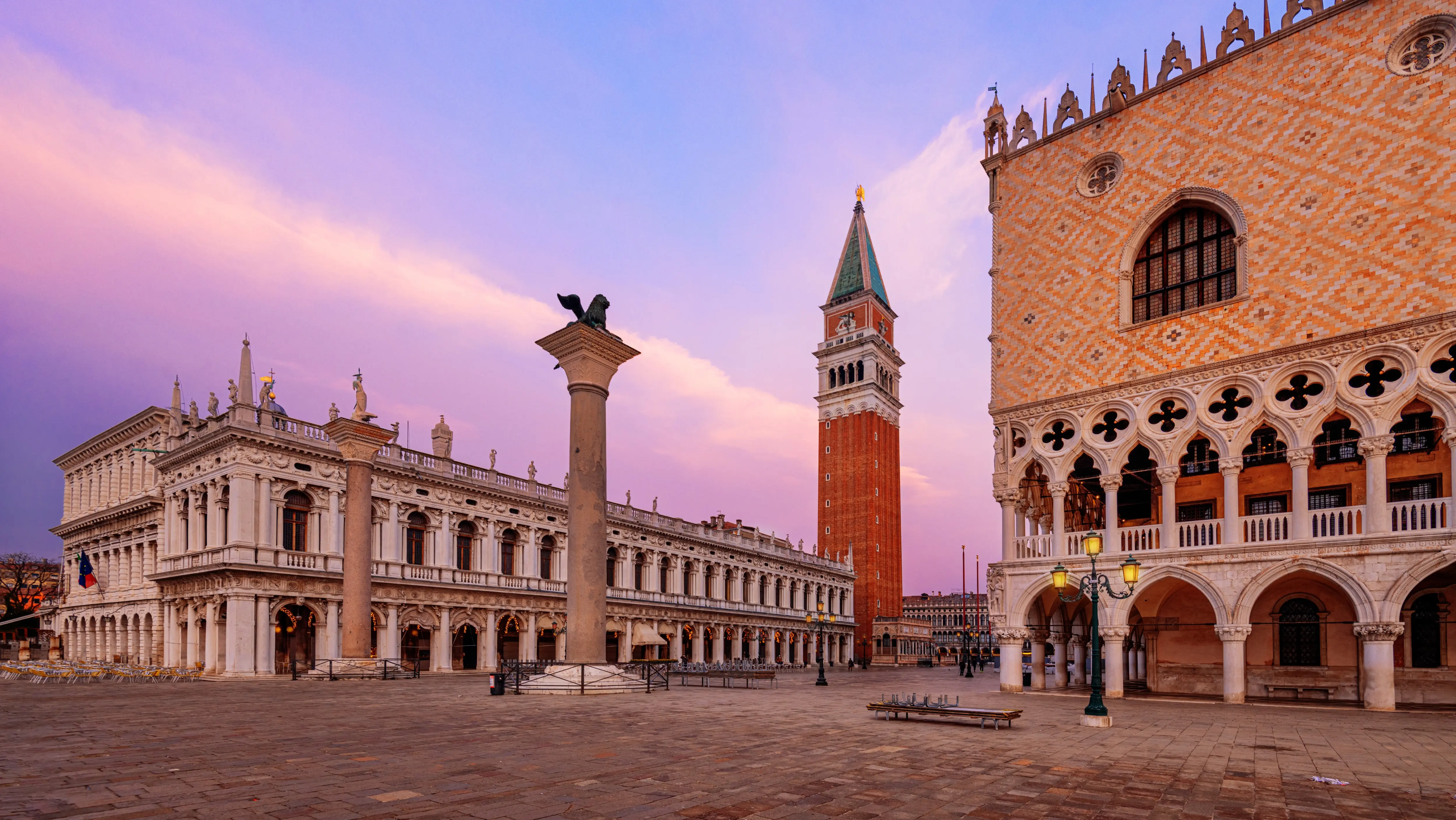 Piazzetta San Marco Venice featuring iconic Columns St Mark and St Theodore standing at edge Venetian Lagoon