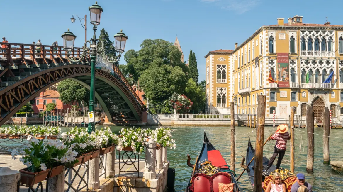 Picturesque view iconic Ponte dell'Accademia Accademia Bridge traditional gondola service Venice Italy