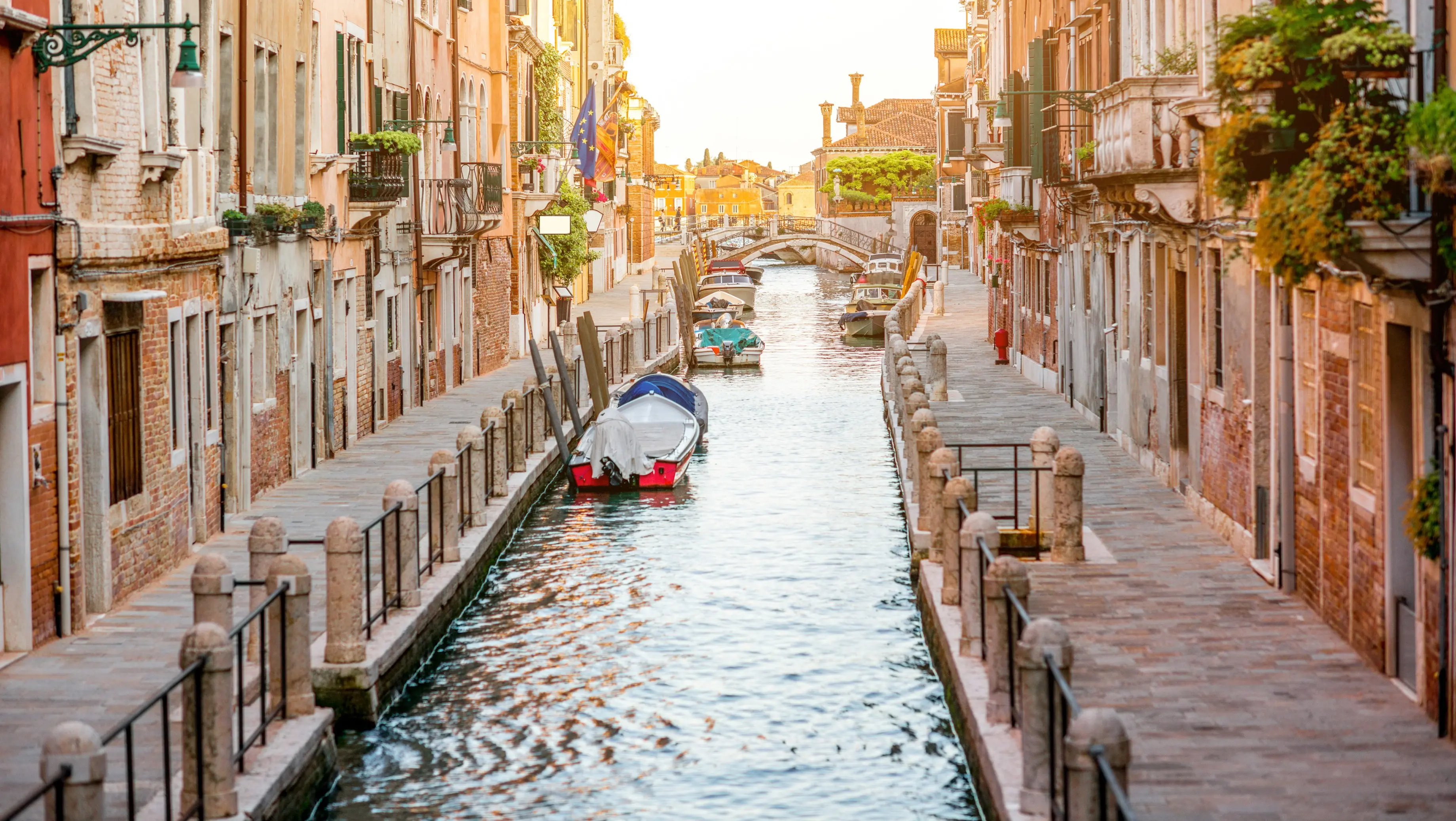 Small romantic water canal in Dorsoduro one of six sestieri districts Venice Italy