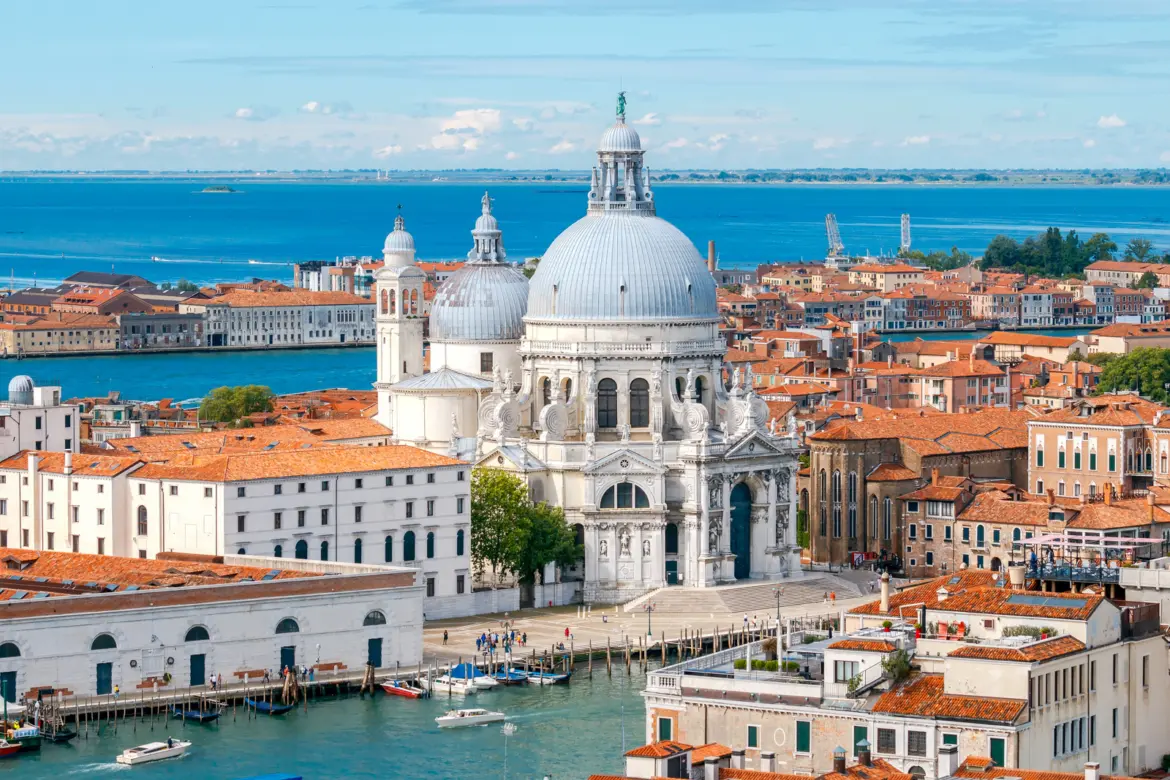 Basilica Santa Maria della Salute rising along Grand Canal Dorsoduro from St Mark's Campanile Venice Italy