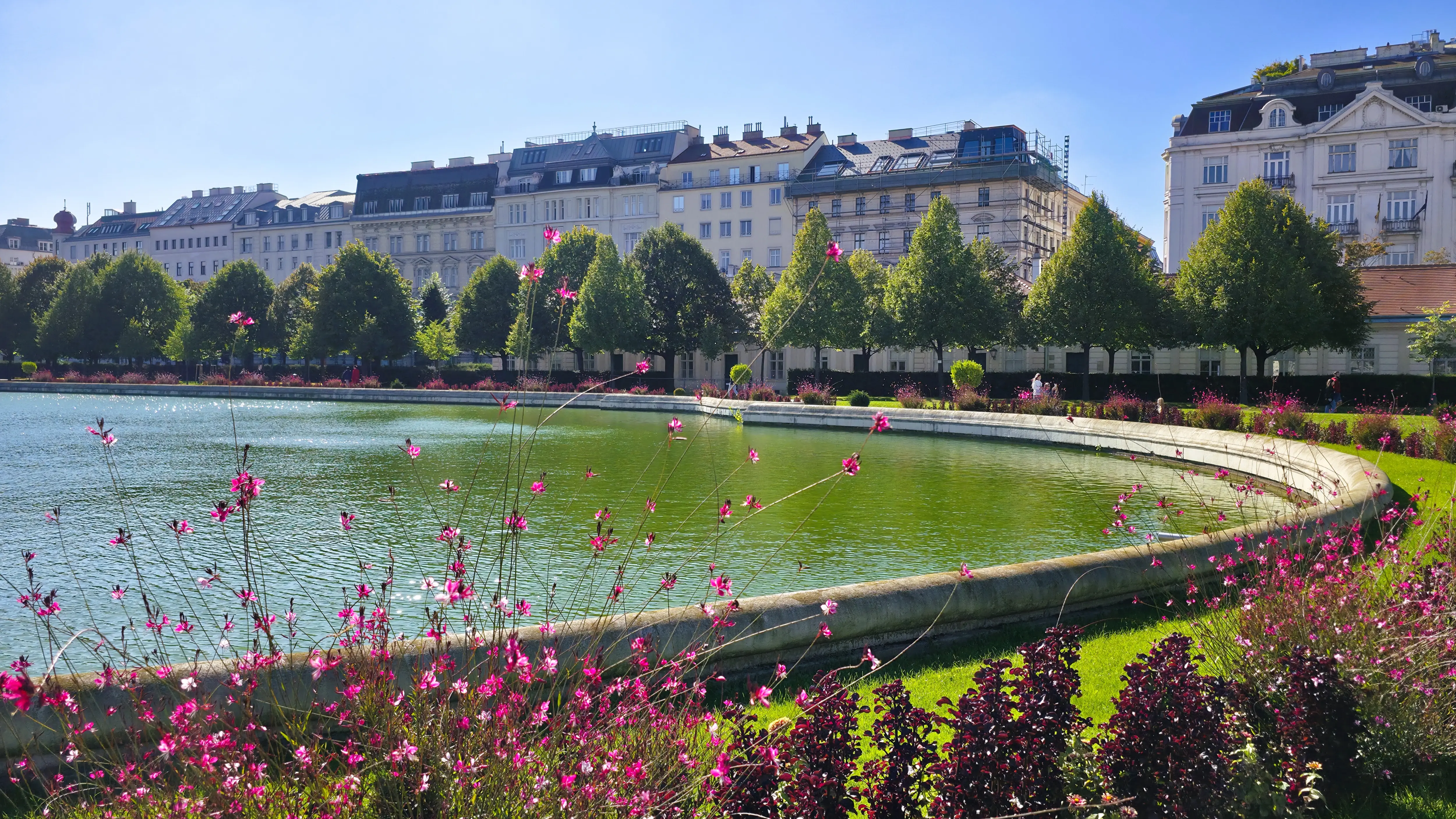 Upper Belvedere Gardens Vienna Austria bright sunny day elegant Baroque landscaping manicured hedges Belvedere Palace complex imperial heritage harmonious blend art architecture nature