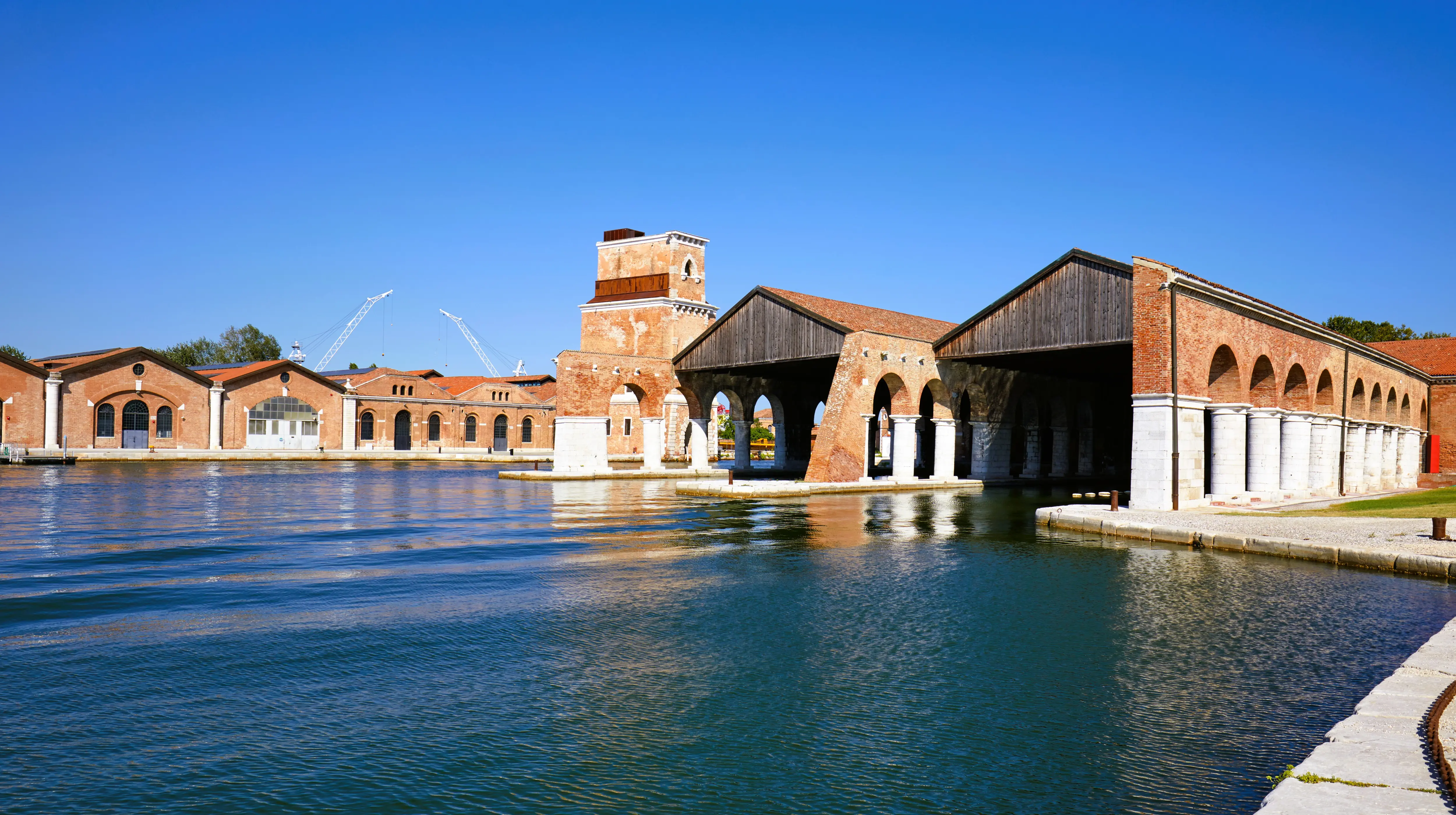 Historic docks and arcaded structures Venetian Arsenal Venice Italy used exhibition spaces during Venice Biennale
