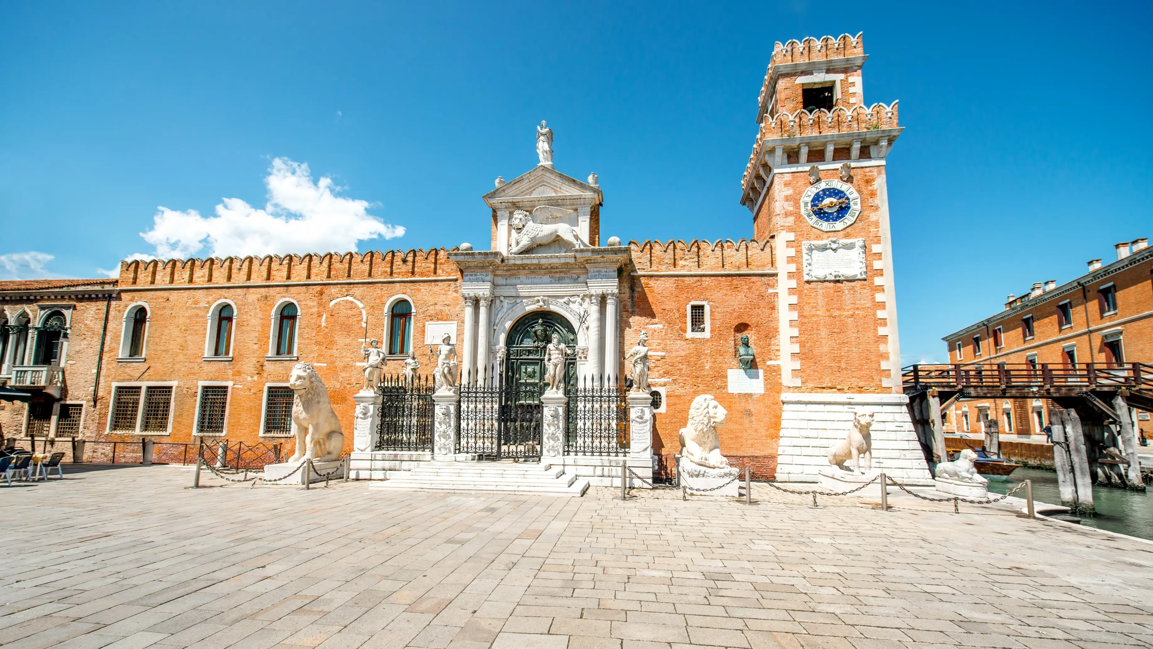 Main gate Venetian Arsenal Arsenale di Venezia Venice Italy guarded historic stone lions symbols Venetian Republic maritime strength military authority Mediterranean trade shipbuilding