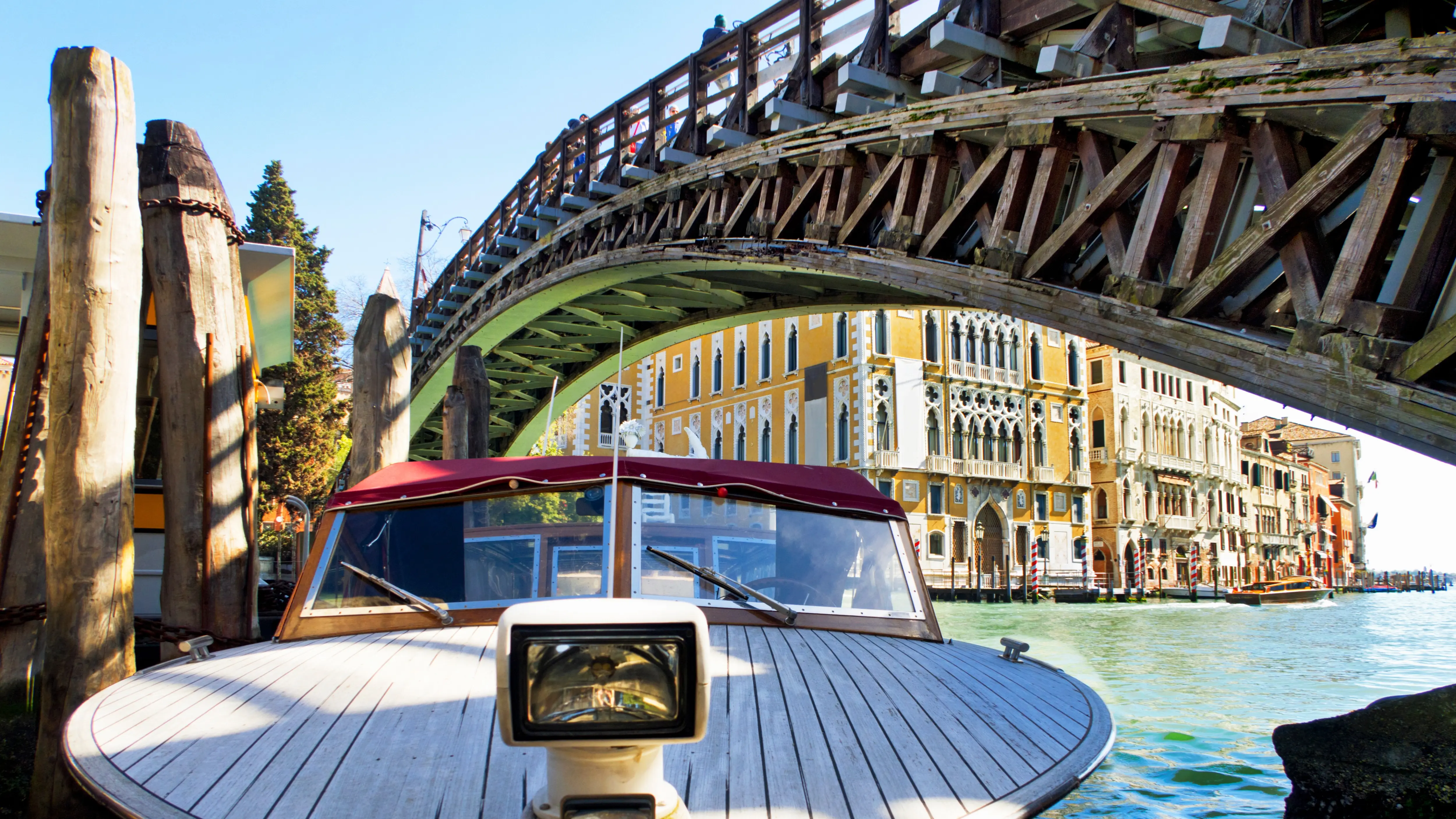Venetian boat moored along Grand Canal under Ponte dell'Accademia Accademia Bridge Venice Italy