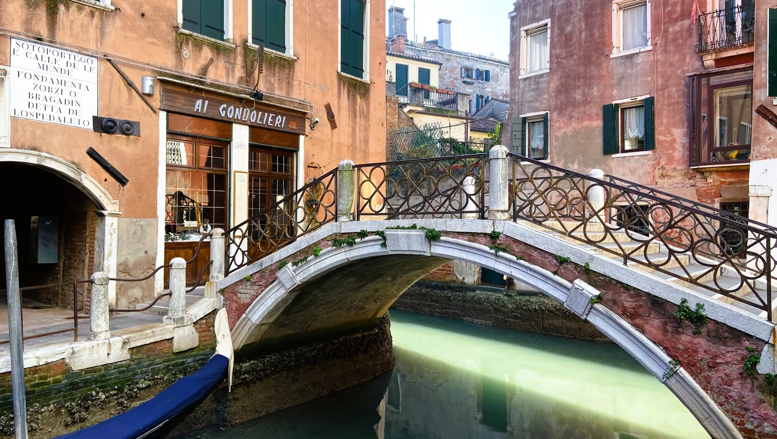 Beautiful Venetian bridge over quiet canal Dorsoduro district Venice Italy