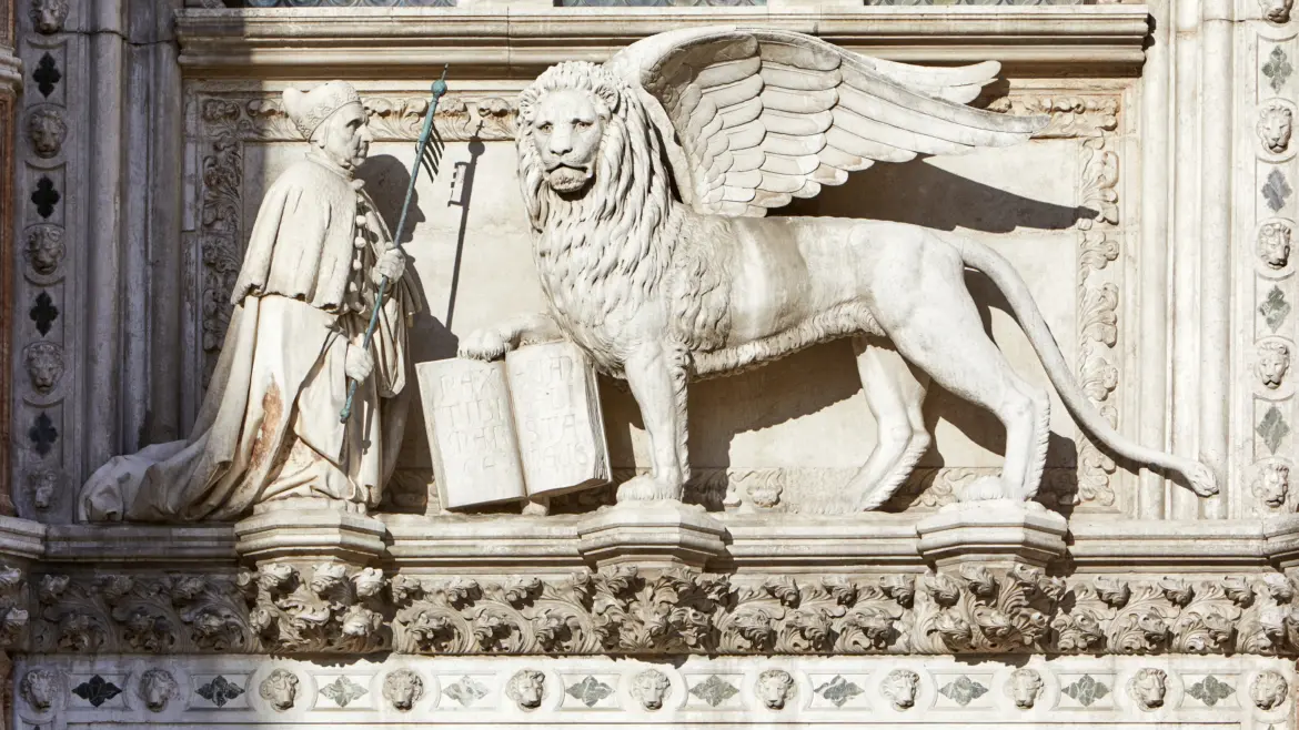 Winged lion and doge Francesco Foscari above Porta della Carta Paper Portal Doge's Palace Venice Italy
