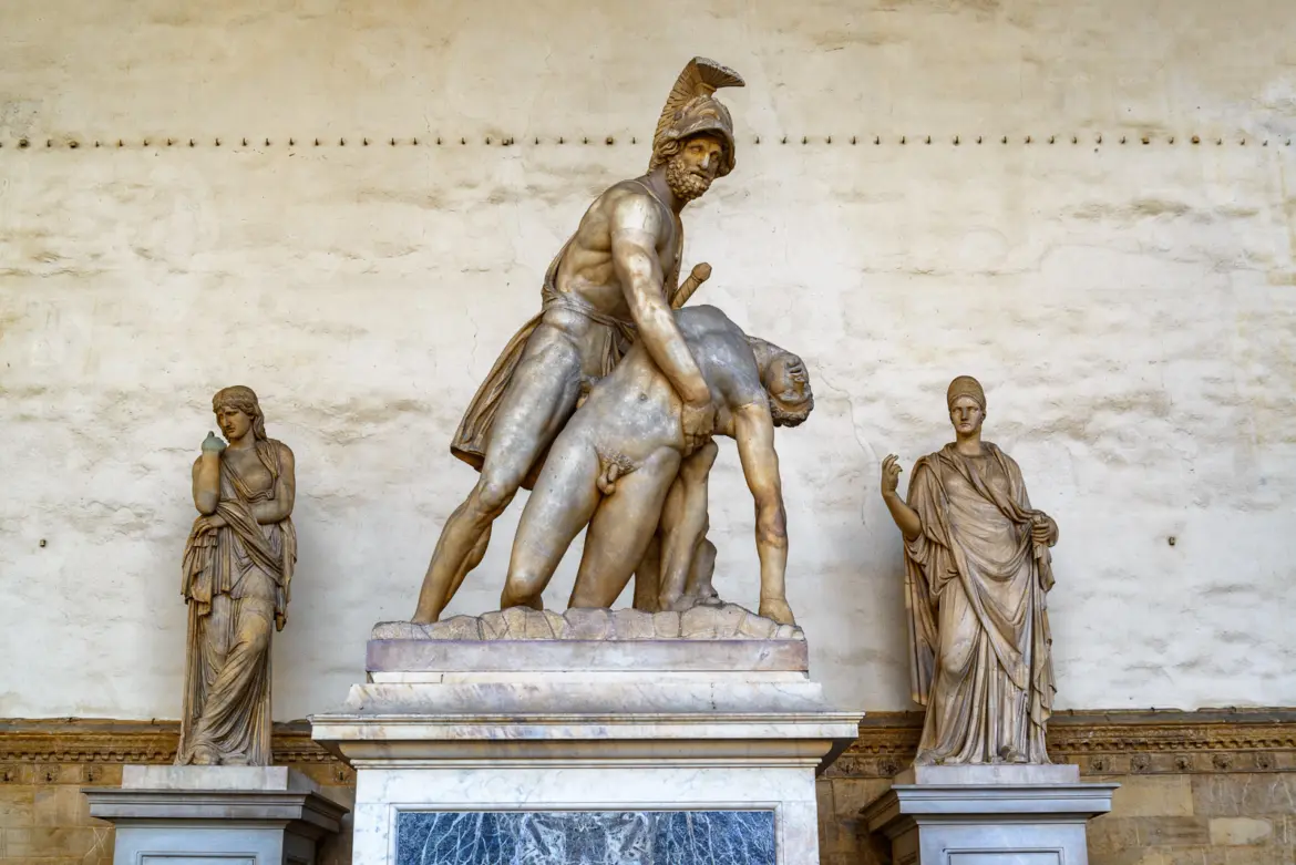 Ancient Roman sculptural group of Ajax carrying the body of Achilles at the Loggia dei Lanzi in Florence flanked by classical female statues
