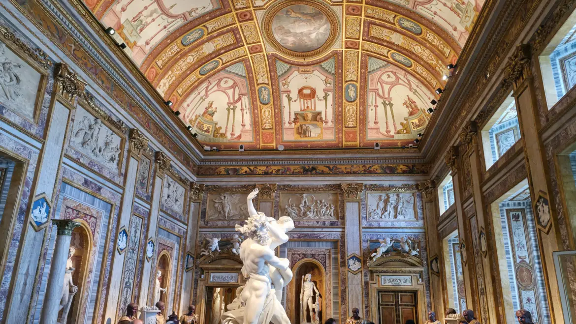 Hall IV of the Emperors in the Galleria Borghese Rome with marble busts frescoed ceiling and ornate decorative details