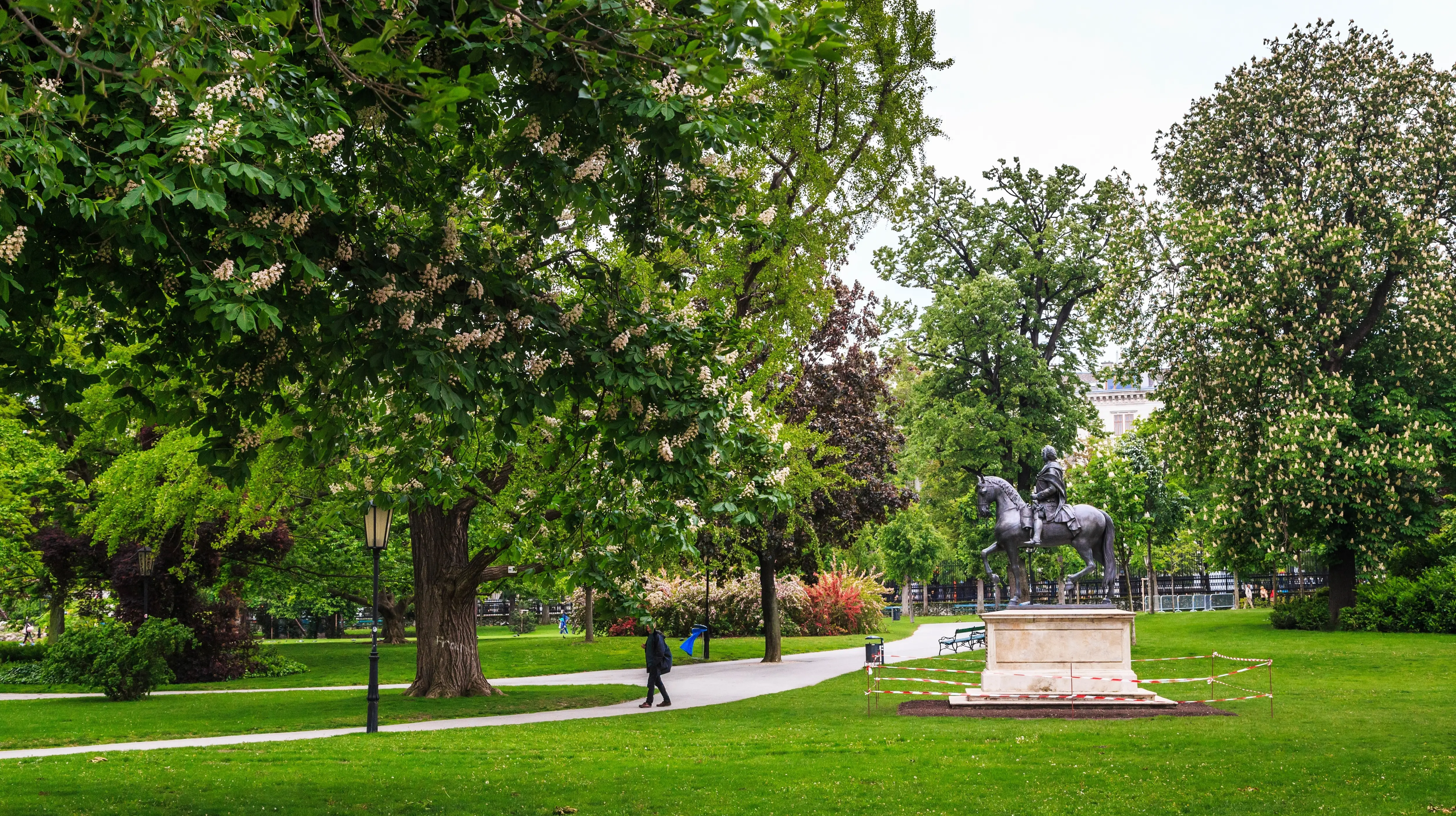 A quiet garden path and lush greenery in a secluded corner of Burggarten in Vienna