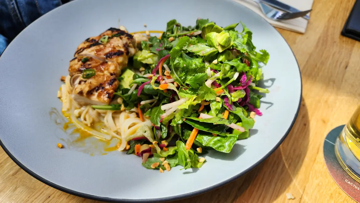 Lemongrass Noodle Salad with grilled chicken, rice noodles, and fresh greens at Cactus Club Cafe Coal Harbour
