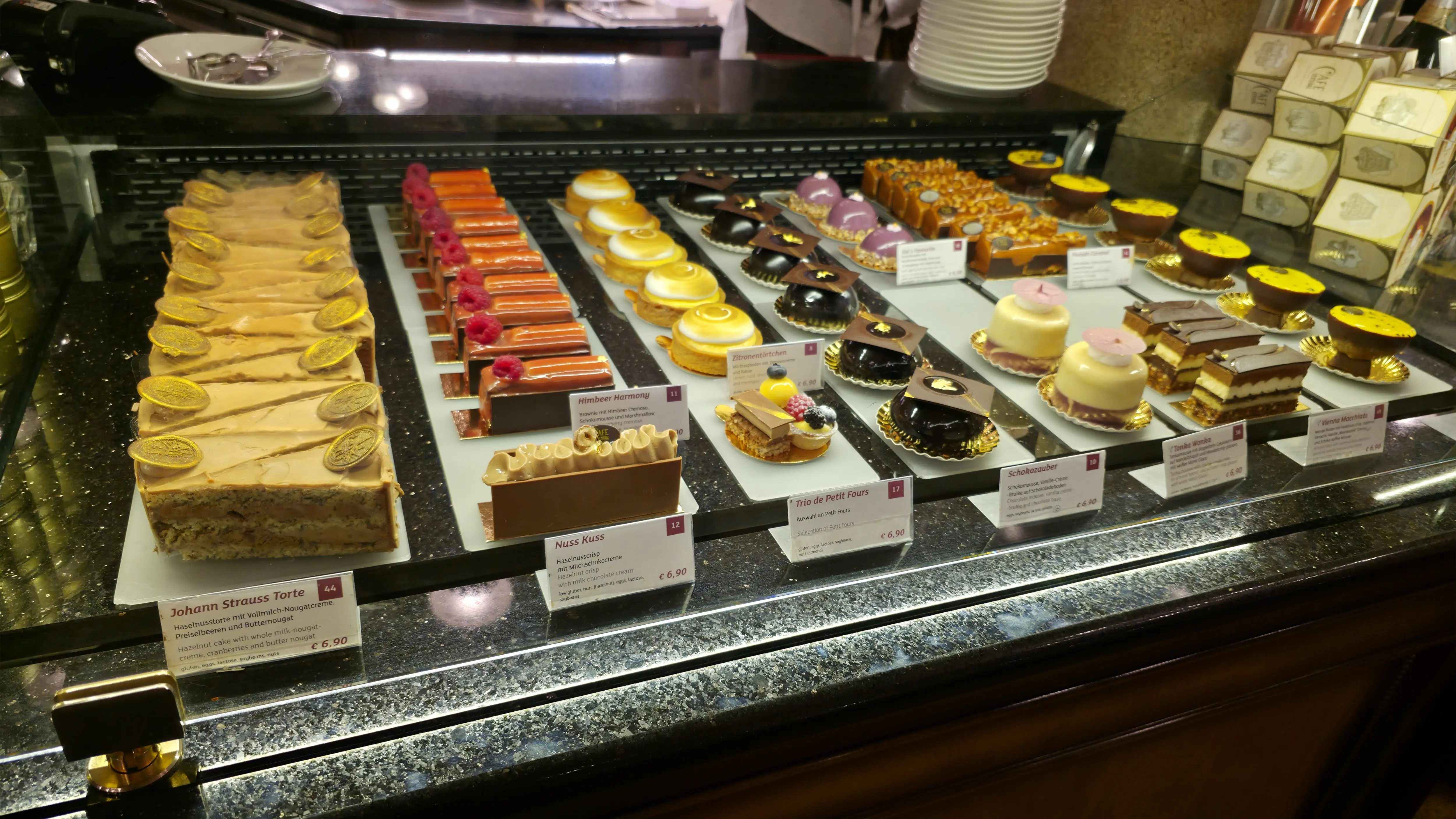 A beautifully arranged pastry display inside Café Central in Vienna, Austria, showcasing classic Viennese cakes and refined dessert craftsmanship