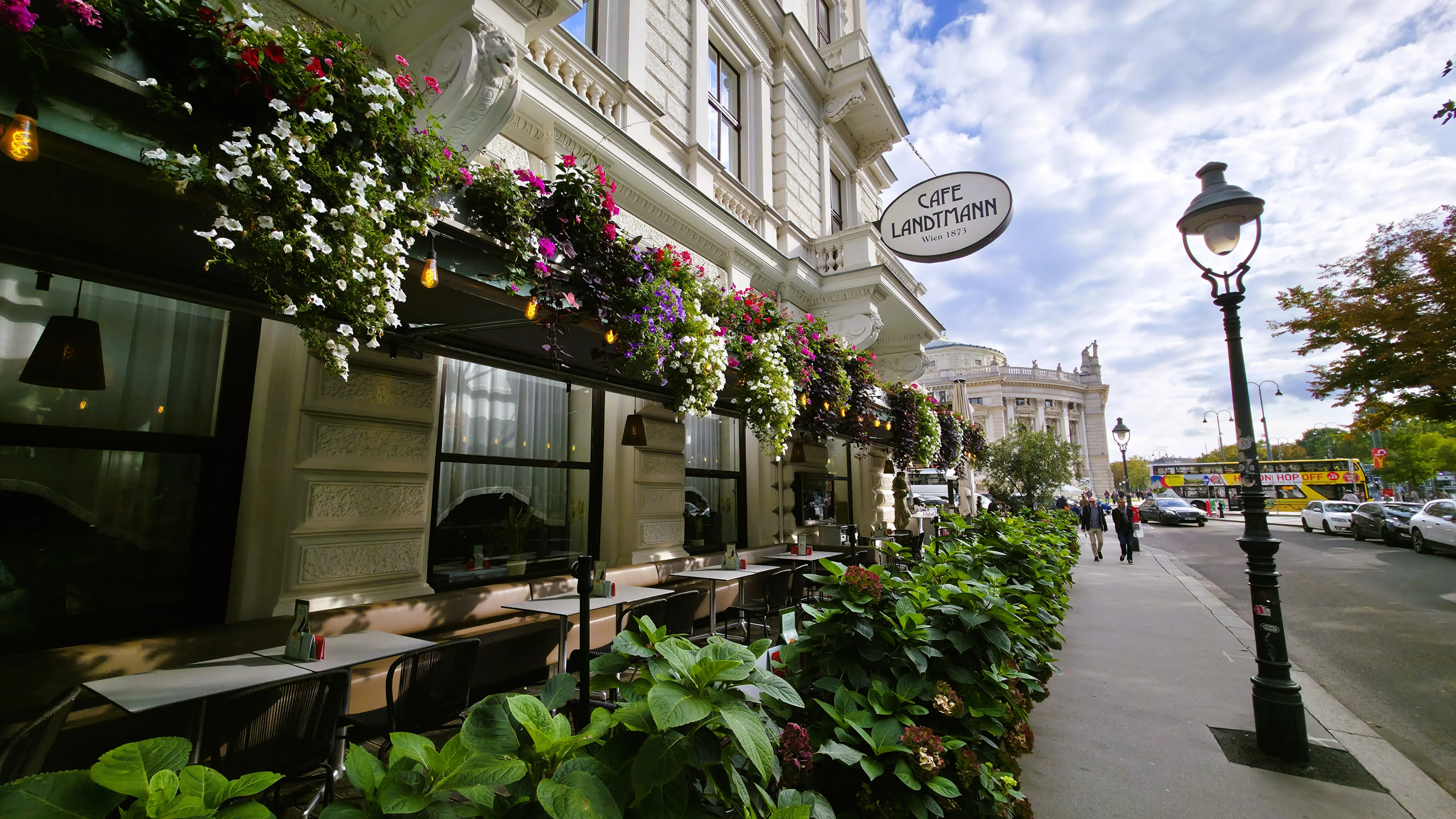 The flower-lined outdoor terrace of Café Landtmann overlooking the Ringstrasse in Vienna