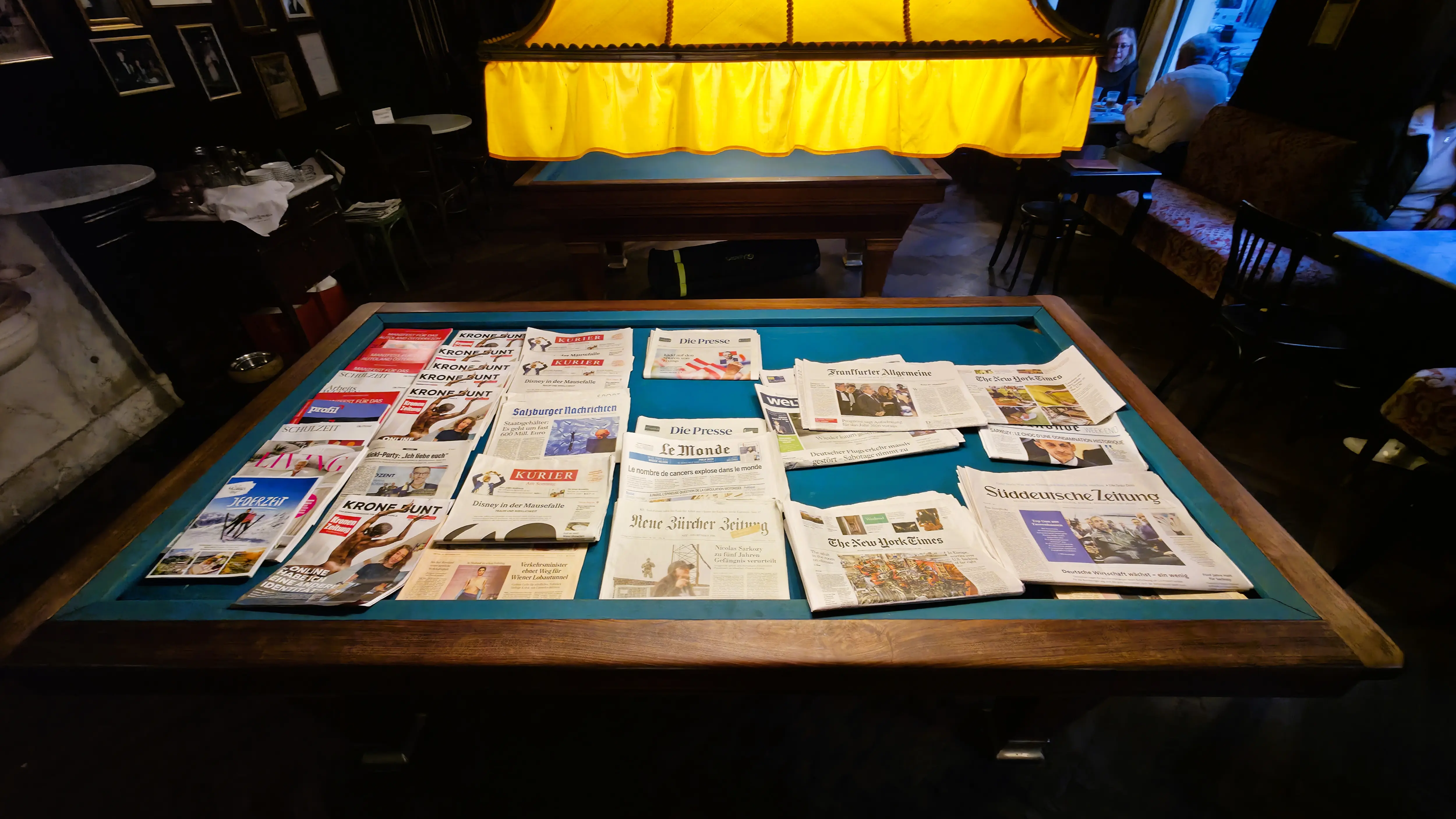 Newspapers and magazines at Café Sperl in Vienna, a hallmark of traditional Viennese coffeehouse culture