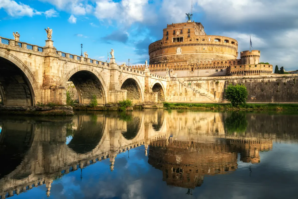 Castel Sant Angelo exterior in Rome showing the cylindrical fortress with angel statue on top and stone walls