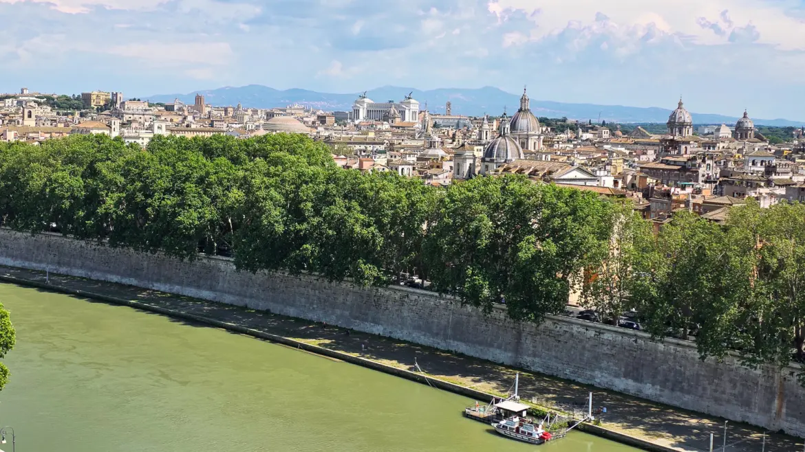 View from the rooftop terrace of Castel Sant Angelo in Rome overlooking the Tiber River bridges and city skyline