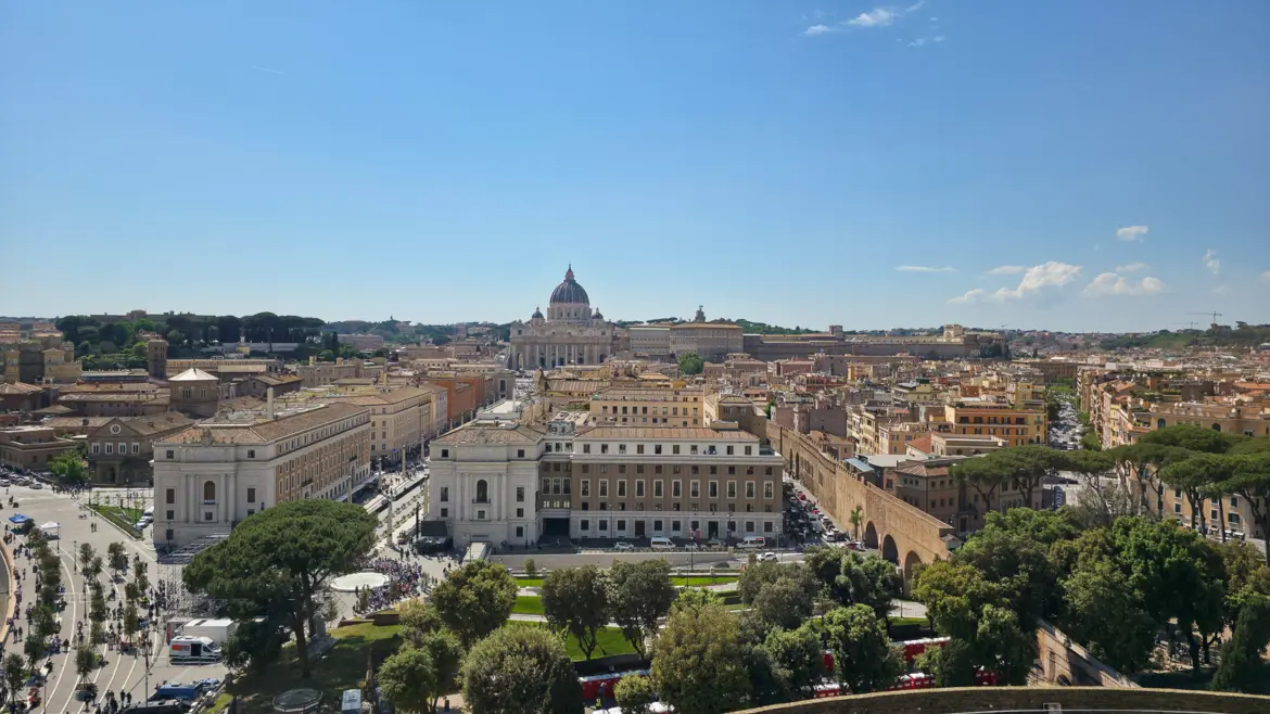 View from Castel Sant Angelo rooftop toward St Peters Basilica and the Vatican rooftops in Rome on a clear day