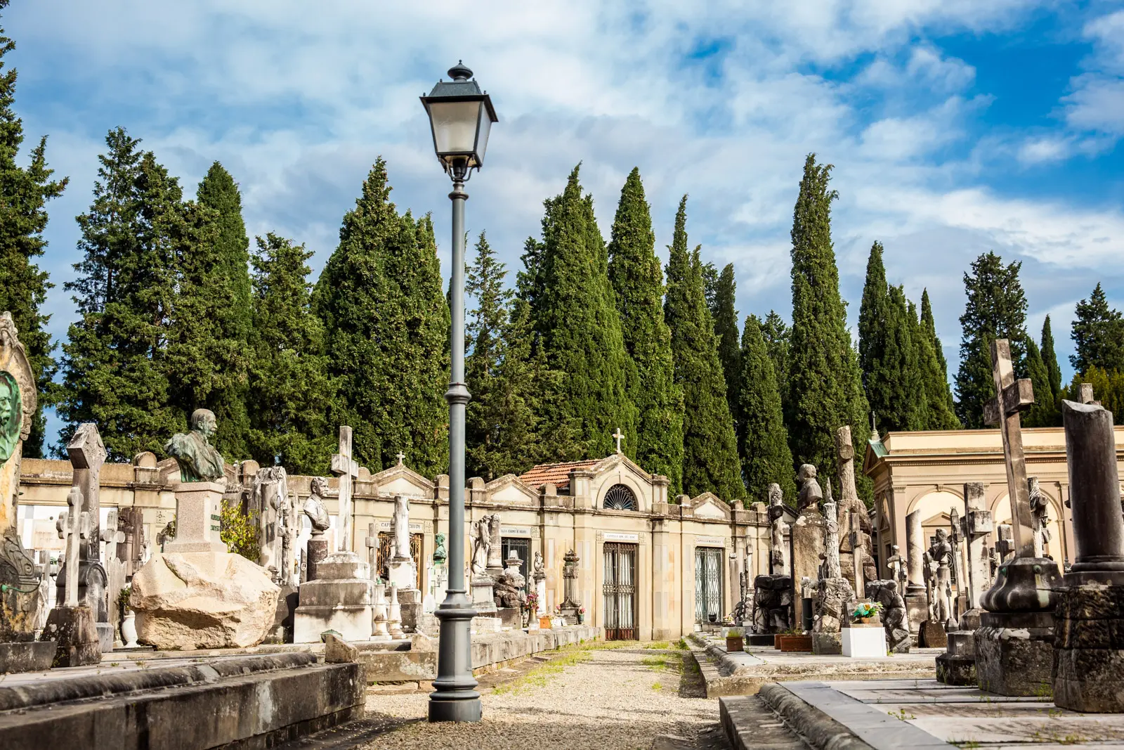 Cimitero delle Porte Sante at San Miniato al Monte in Florence, with sculpted tombs, private chapels, and tall cypress trees creating a contemplative hillside cemetery