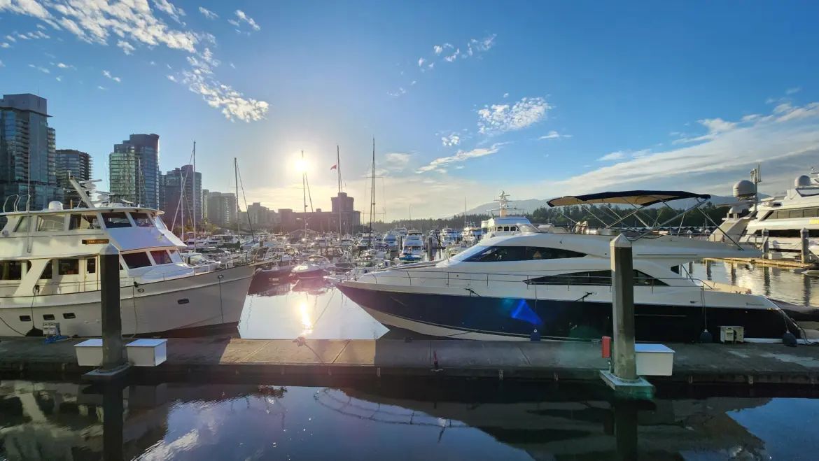 Yachts and boats moored at the Coal Harbour marina in Vancouver during golden hour