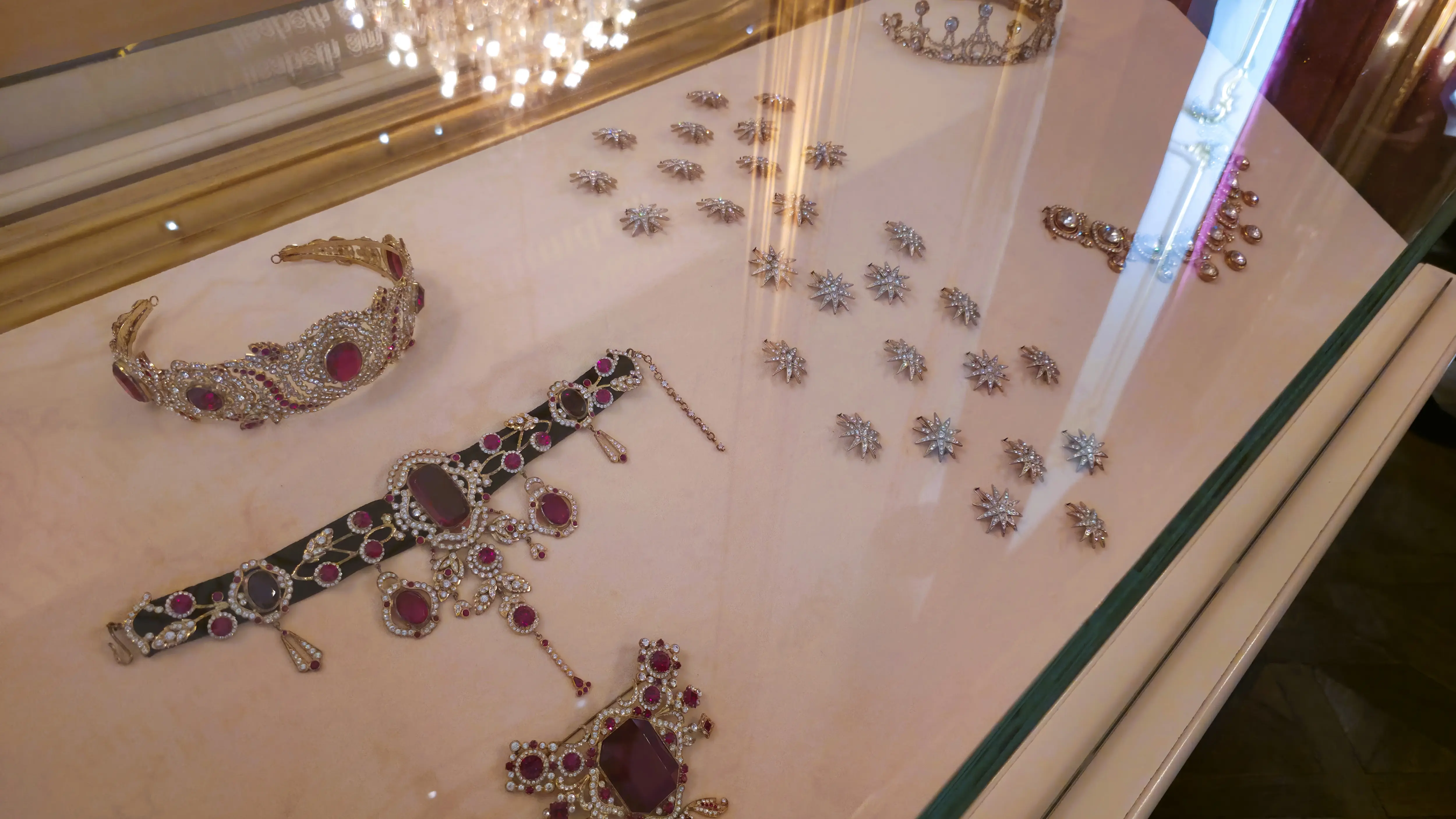 Jewelry of Empress Elisabeth (Sisi) on display at the Sisi Museum, including necklaces, brooches, and a tiara