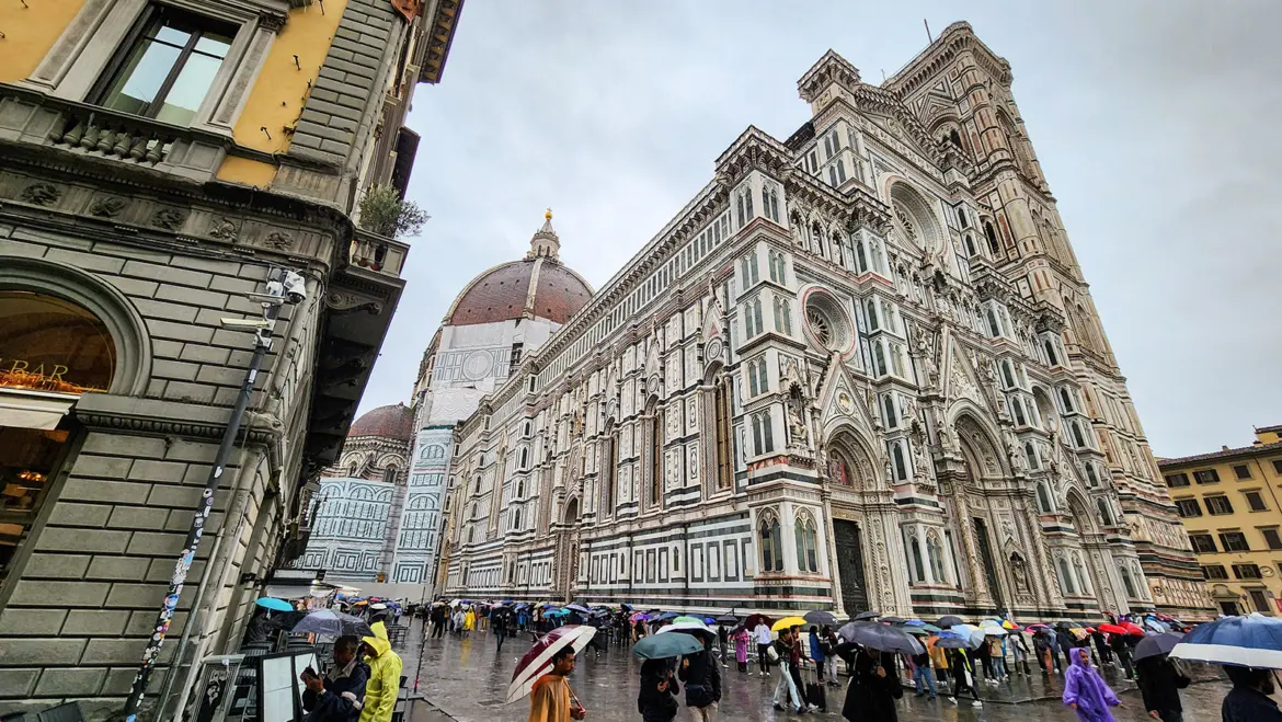 Neo-Gothic façade of Florence Cathedral Santa Maria del Fiore in Piazza del Duomo completed in the 19th century decorated with elaborate marble patterns statues and ornate architectural details
