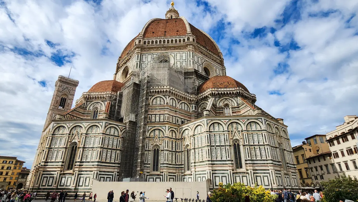 Cathedral of Santa Maria del Fiore from Piazza del Duomo Florence Italy showing Brunelleschi’s dome rising above the marble exterior and revealing the monumental scale of Florence’s most famous landmark