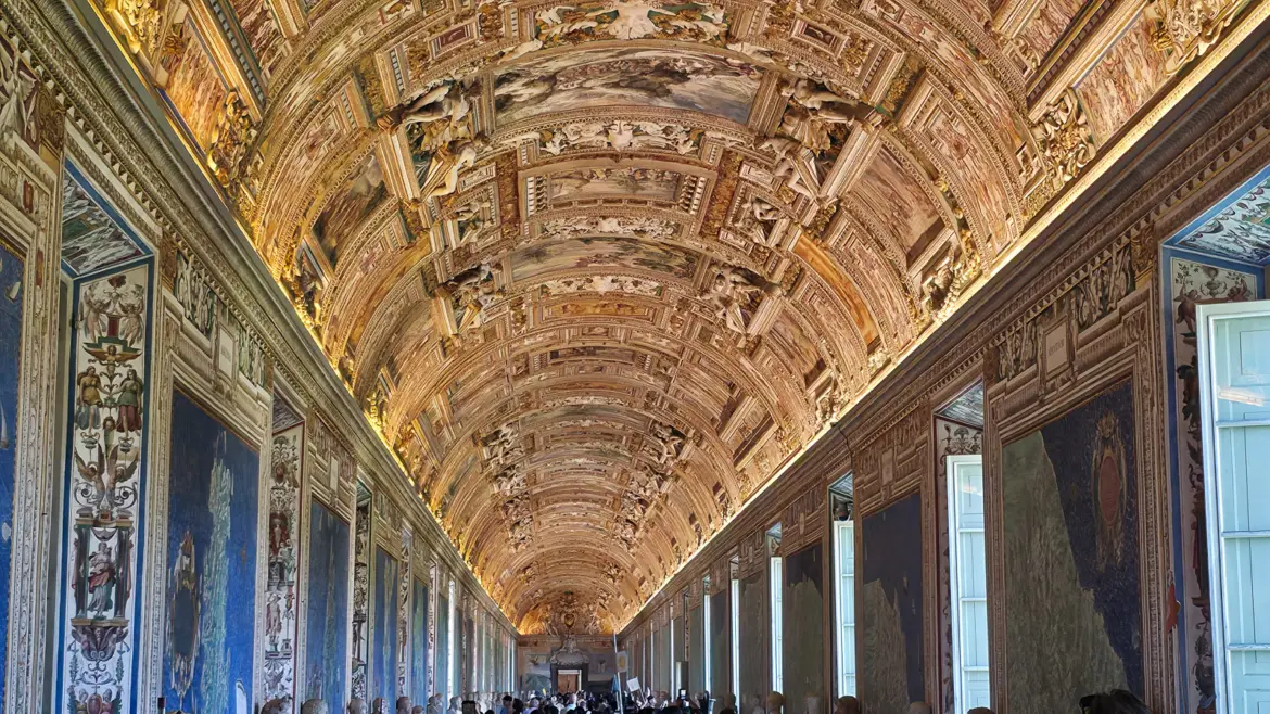 The Gallery of Maps in the Vatican Museums with painted ceiling frescoes gilded frames and map panels lining the walls