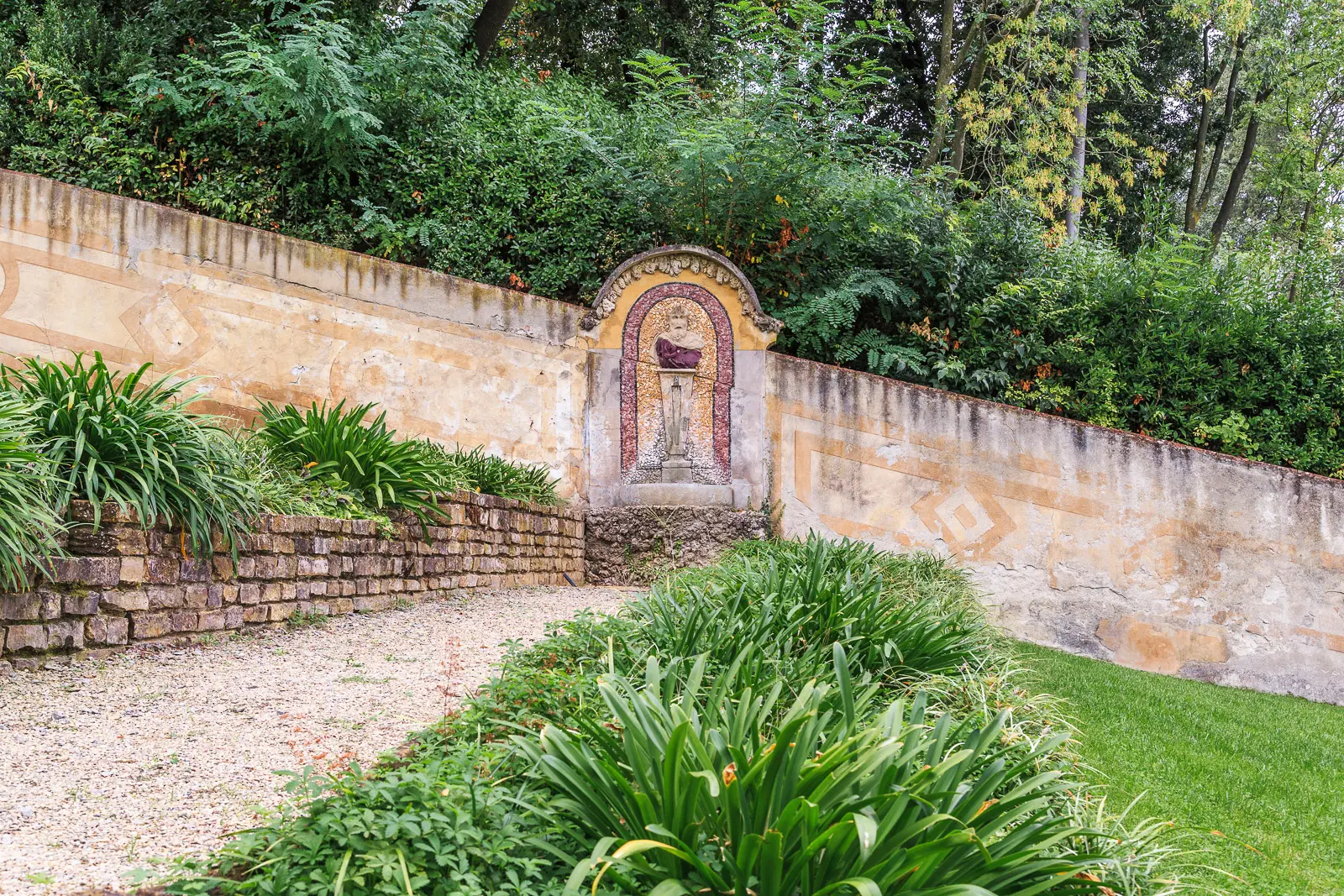 Floral terrace at Giardino Bardini in Florence during autumn with golden light seasonal colours and the city visible below