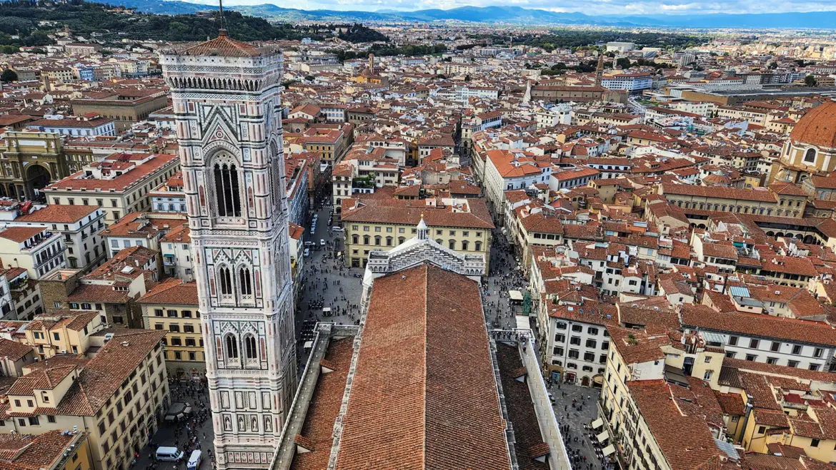 Giotto’s Bell Tower seen from the top of Brunelleschi’s dome at Florence Cathedral offering a unique aerial perspective of the Duomo complex and Renaissance architecture