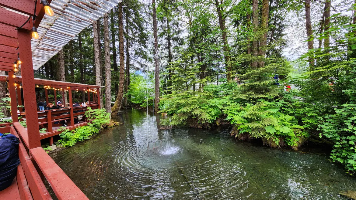 Gold Creek Salmon Bake Pond Dining Area Juneau Covered dining area overlooking a pond with a fountain at the Gold Creek Salmon Bake in Juneau, Alaska