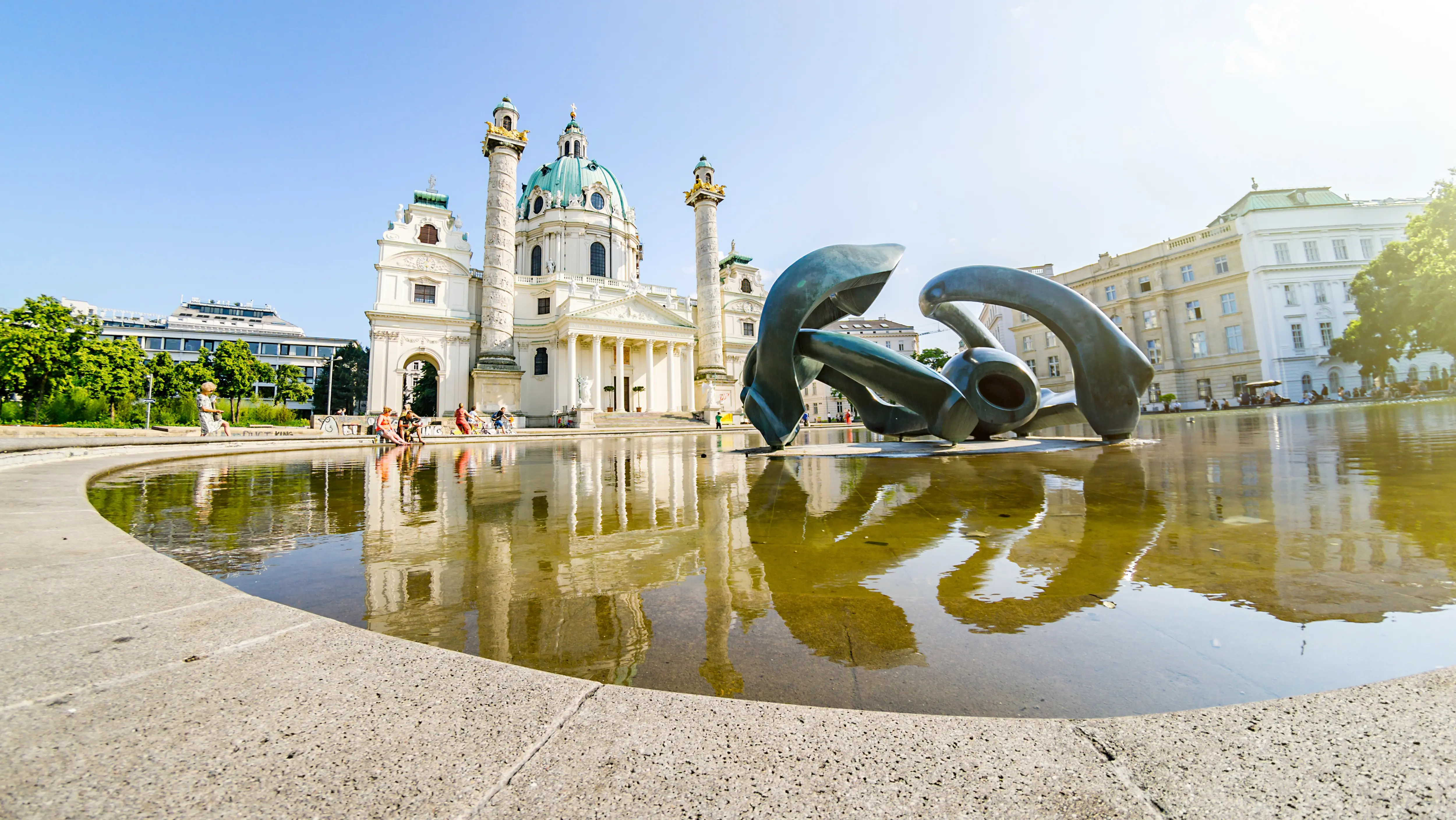 Henry Moore’s Hill Arches sculpture at the reflecting pool in Karlsplatz, Vienna, with Karlskirche in the background