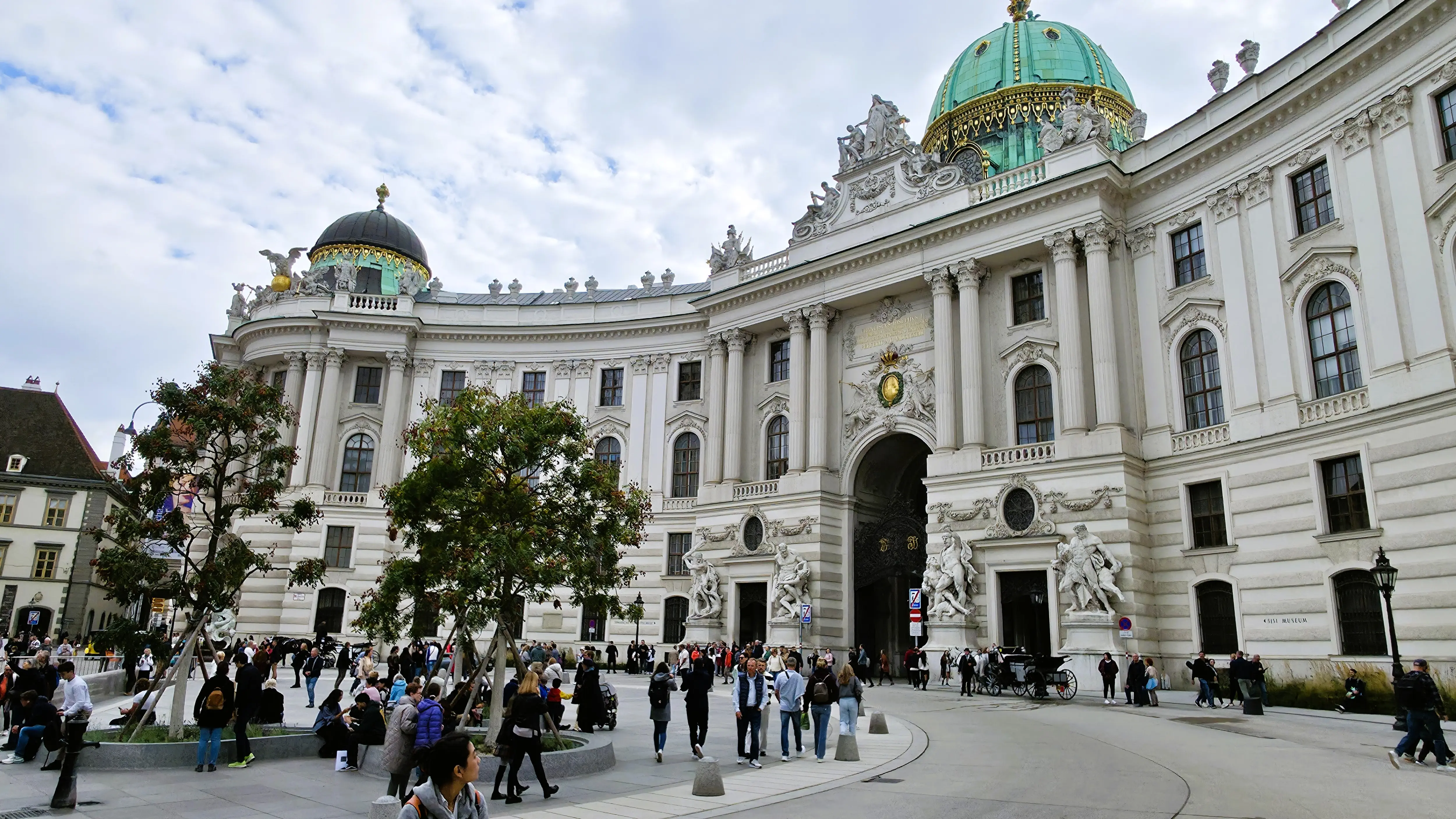 St. Michael’s Wing of the Hofburg Palace at Michaelerplatz in Vienna, where imperial architecture meets everyday city life