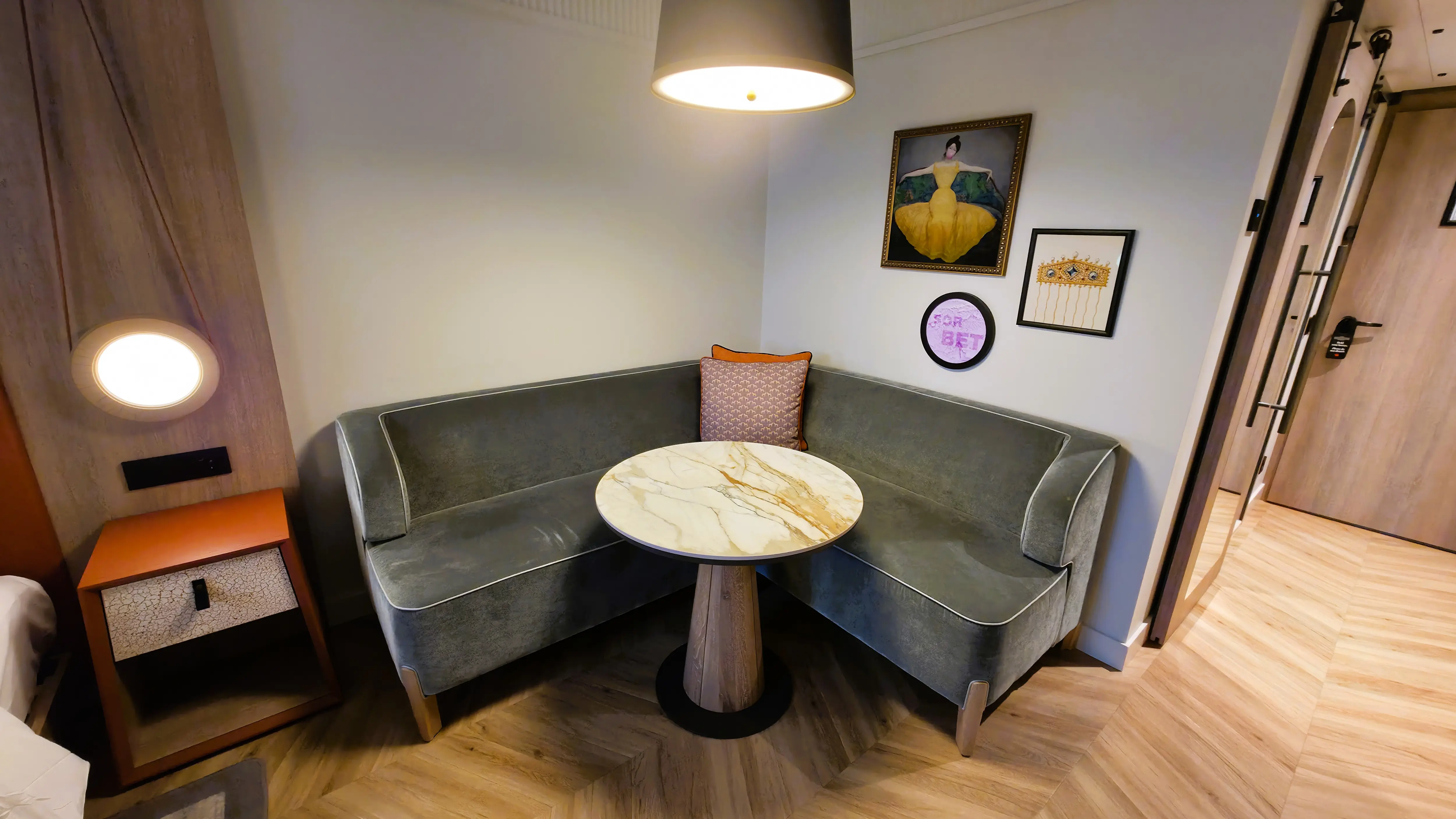 The sitting area and marble table in the Deluxe King Room at the Imperial Riding School, Autograph Collection in Vienna