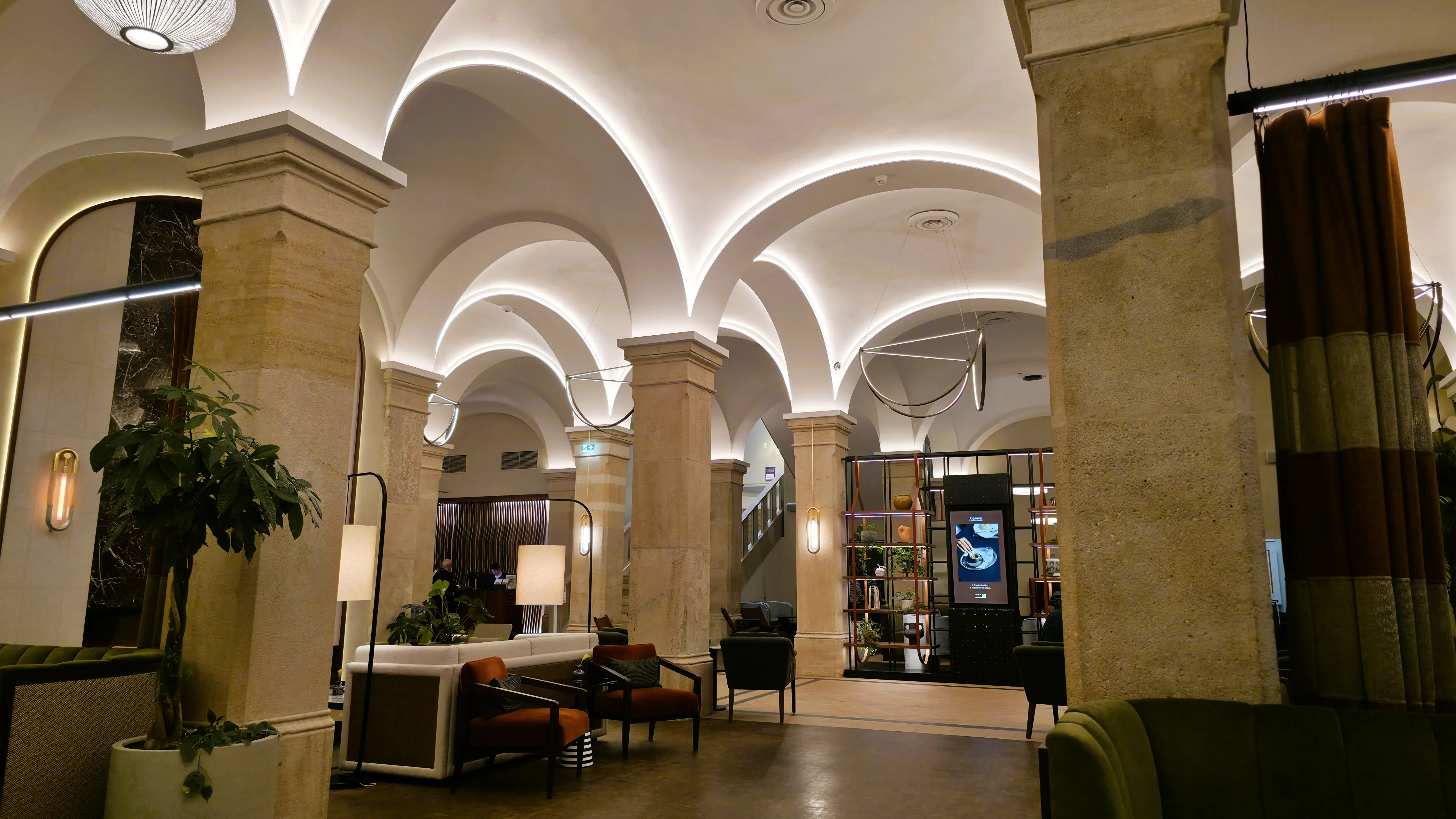 The lobby of the Imperial Riding School, Autograph Collection in Vienna, highlighting natural light, open space, and refined materials