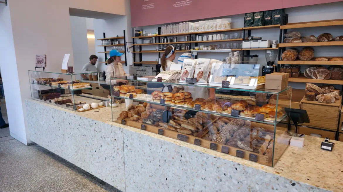 Handcrafted organic sourdough loaves on display inside Joseph Brot in Vienna