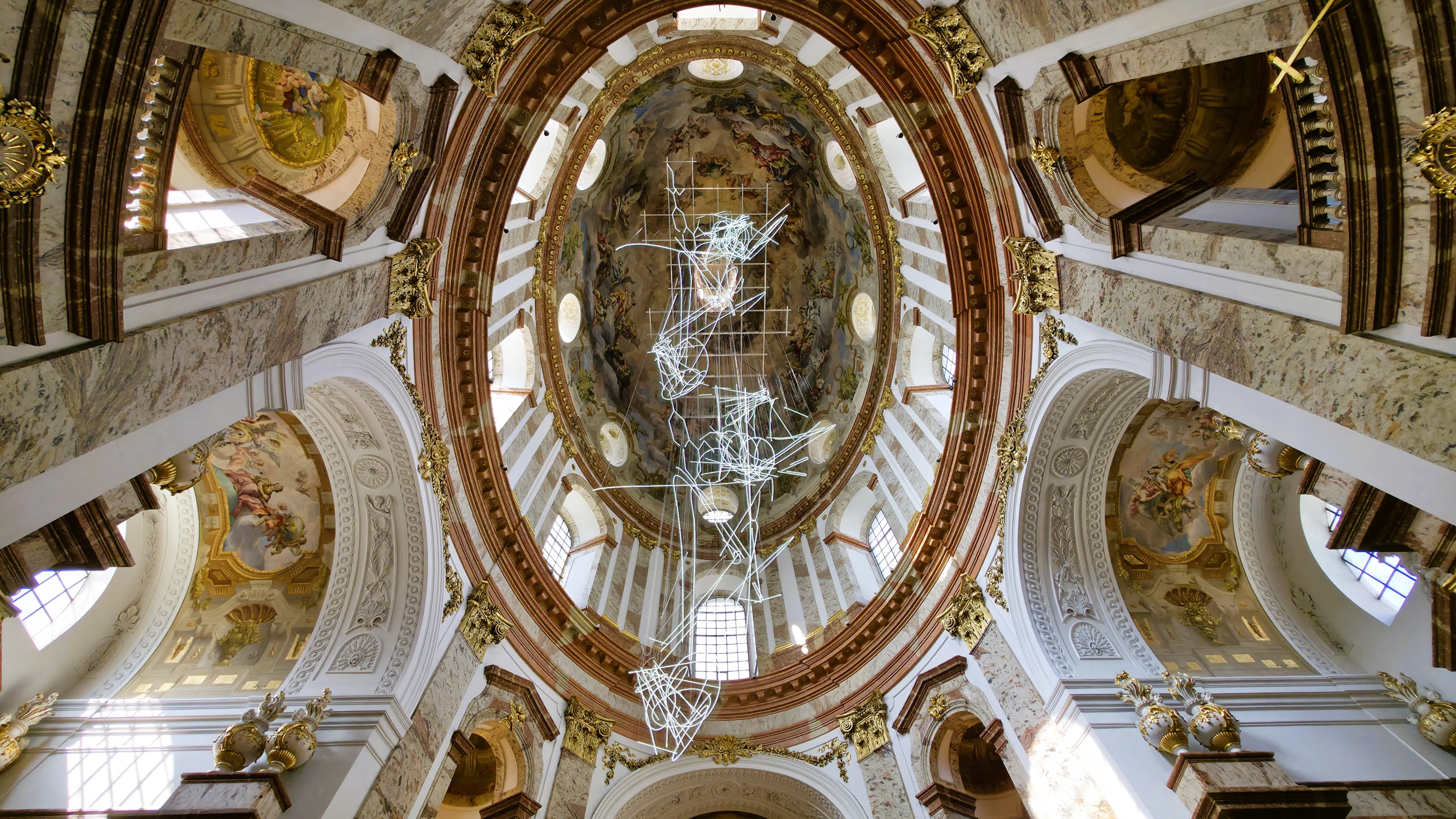 The frescoed dome inside the Karlskirche in Vienna, Austria, painted by Johann Michael Rottmayr with rich Baroque symbolism