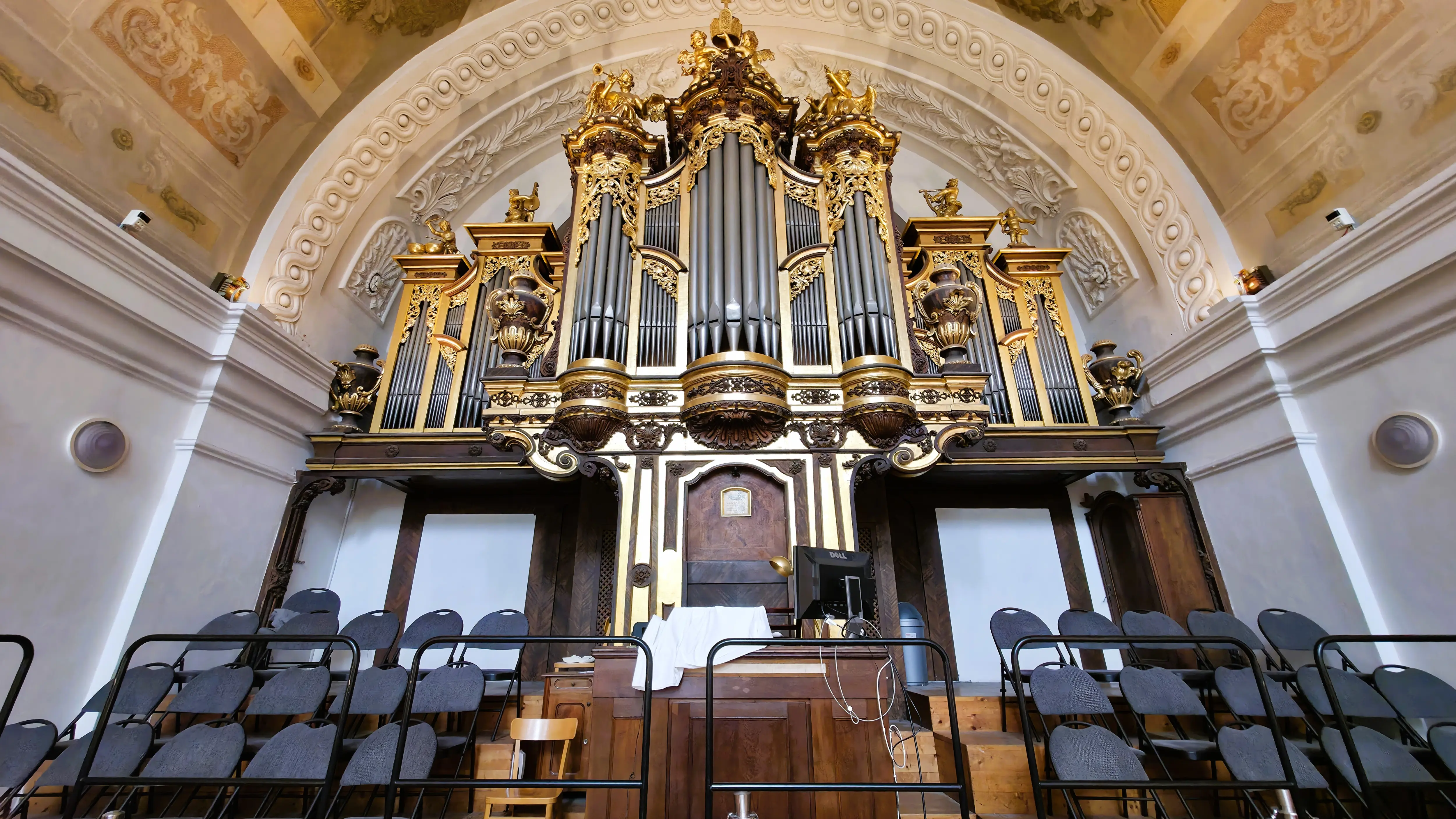 The pipe organ inside the Karlskirche in Vienna, Austria, positioned on the west gallery within the domed interior