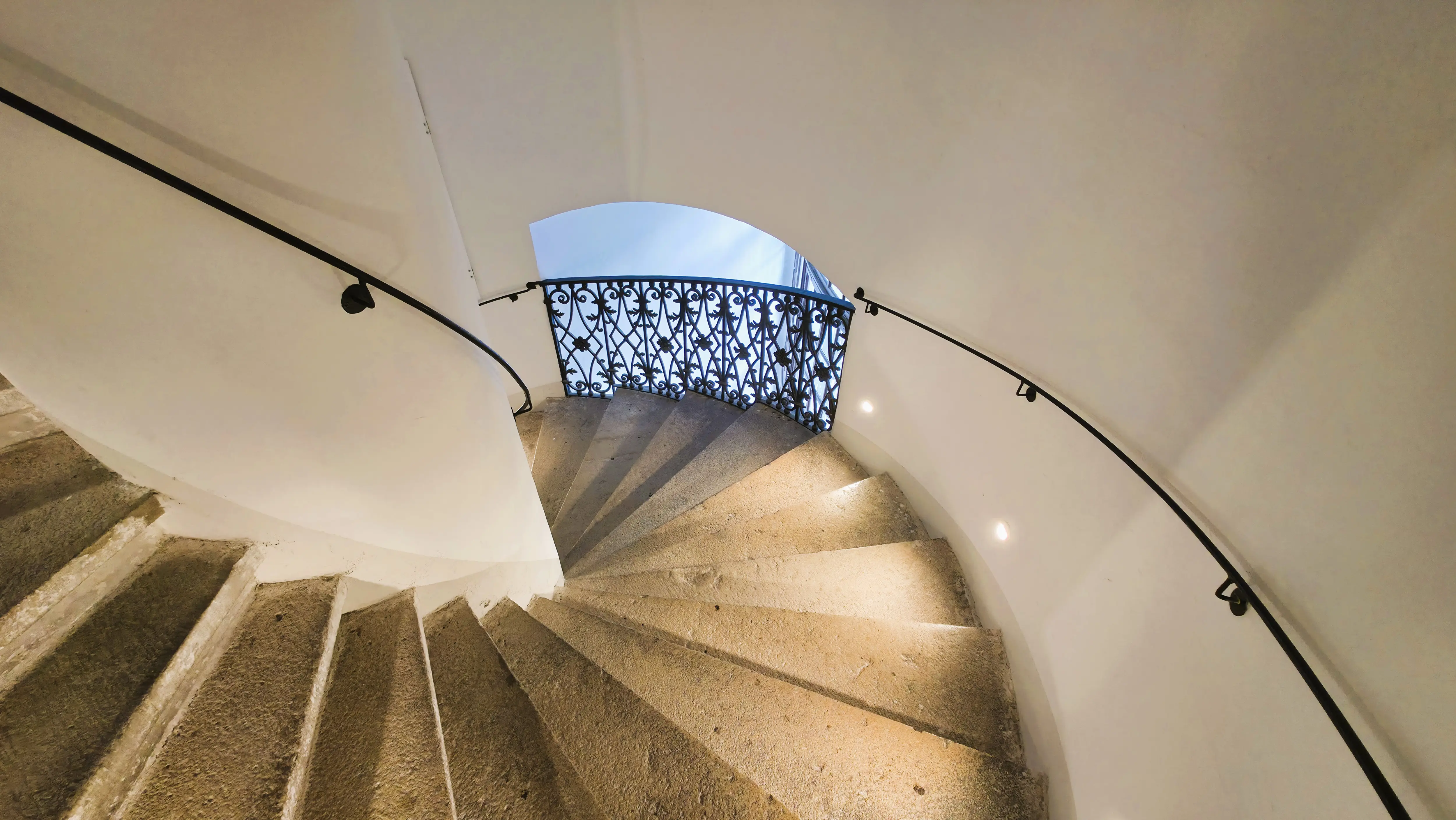 Interior stairway leading to the rooftop and dome walkways inside the Karlskirche in Vienna, Austria